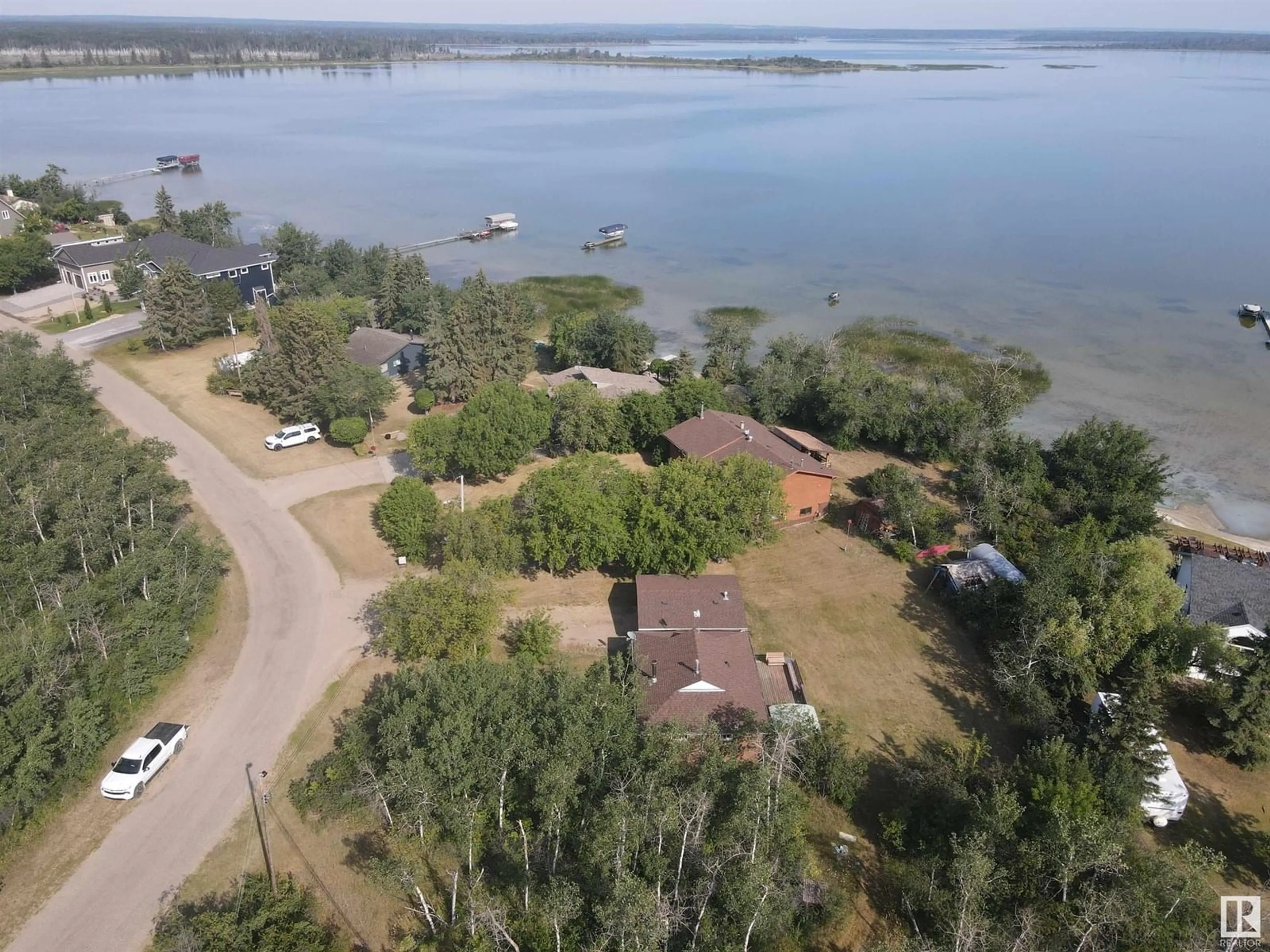 A pic from outside/outdoor area/front of a property/back of a property/a pic from drone, water/lake/river/ocean view for 32 47018 TWP RD 604A, Rural Bonnyville M.D. Alberta T9N2J6
