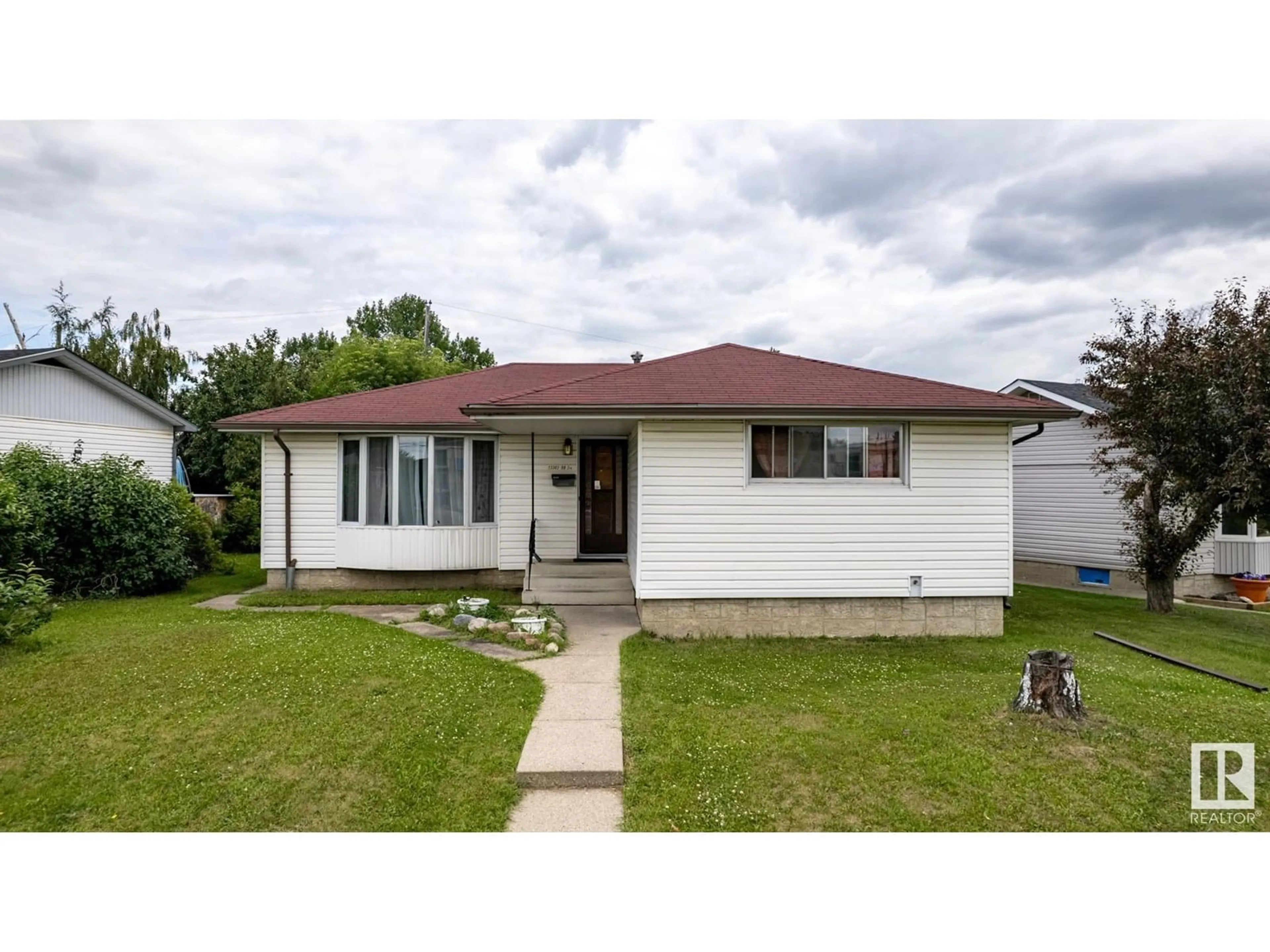 Home with vinyl exterior material, street for NW - 13303 58 ST, Edmonton Alberta T5A0P9