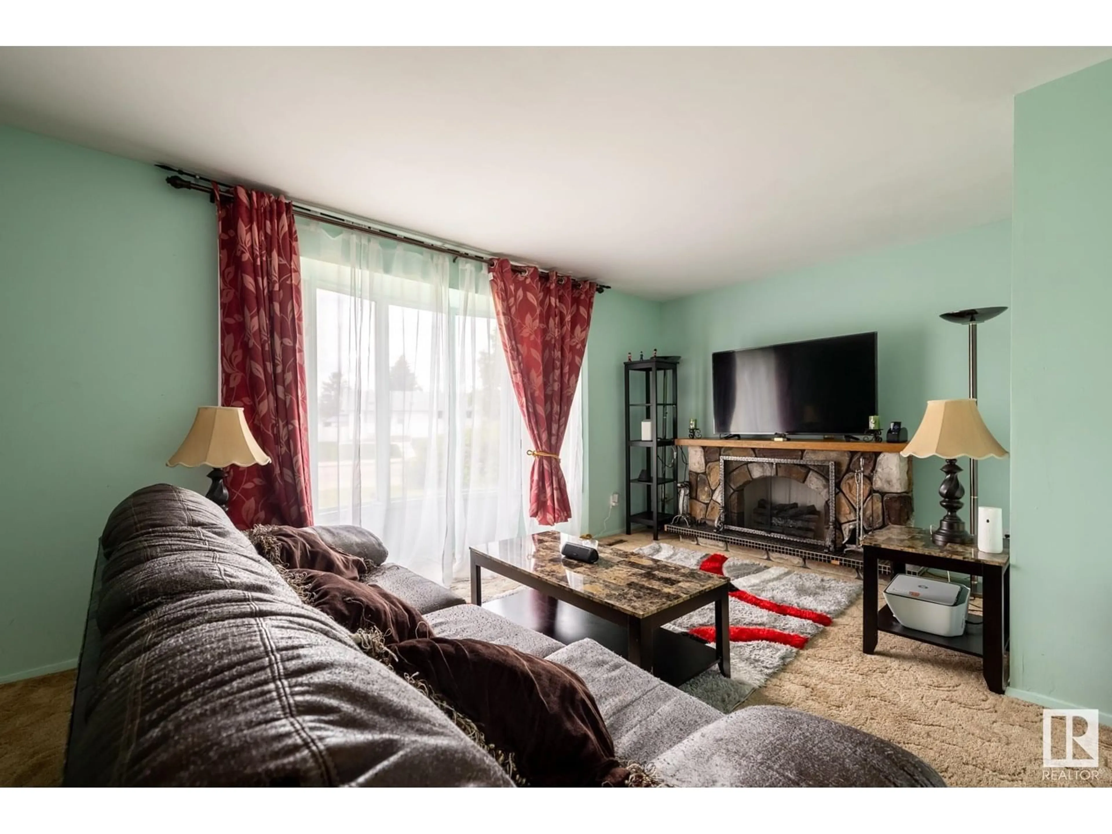 Living room with furniture, wood/laminate floor for NW - 13303 58 ST, Edmonton Alberta T5A0P9