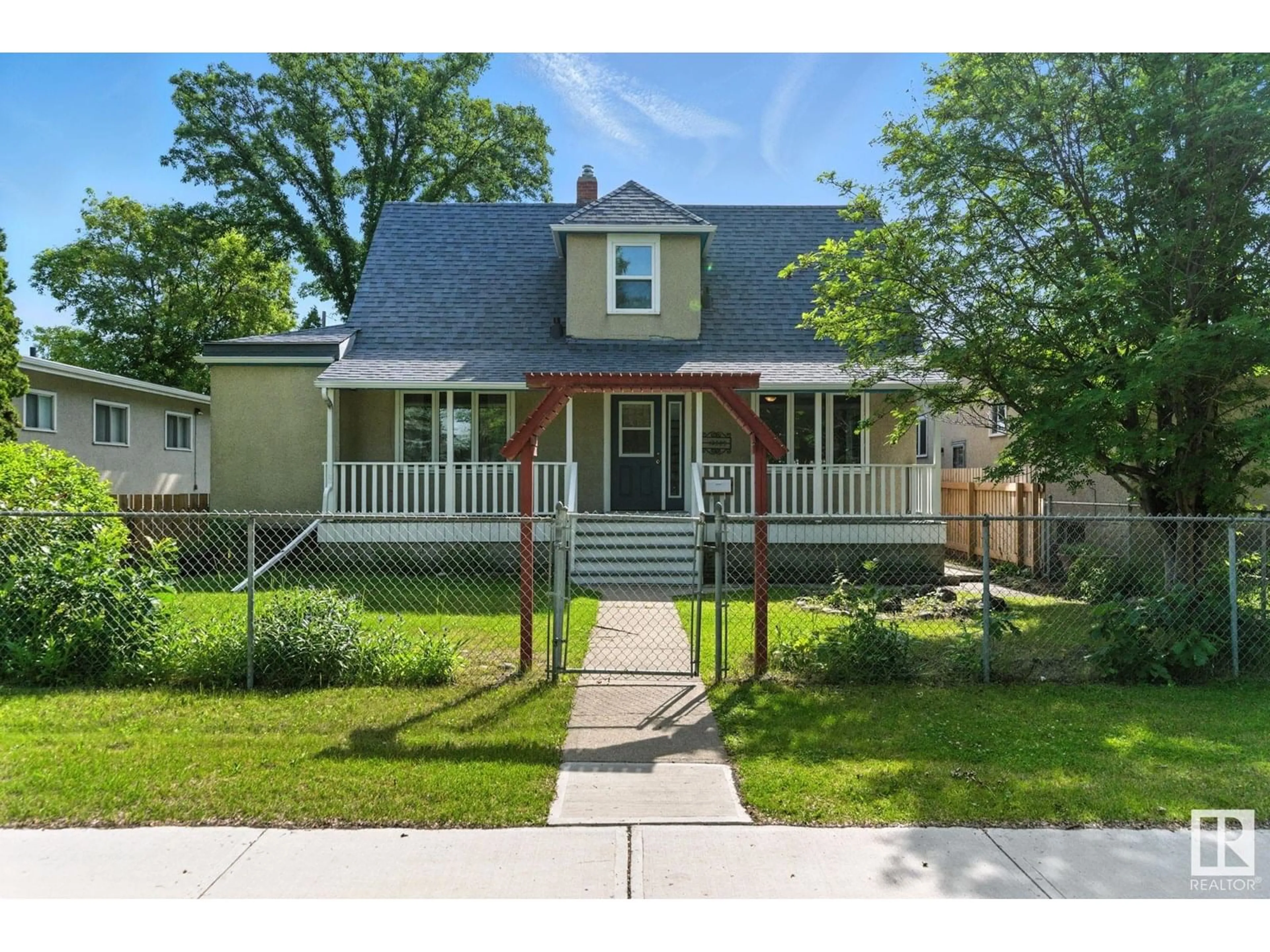 Home with vinyl exterior material, street for 12509 81 ST, Edmonton Alberta T5B2T8