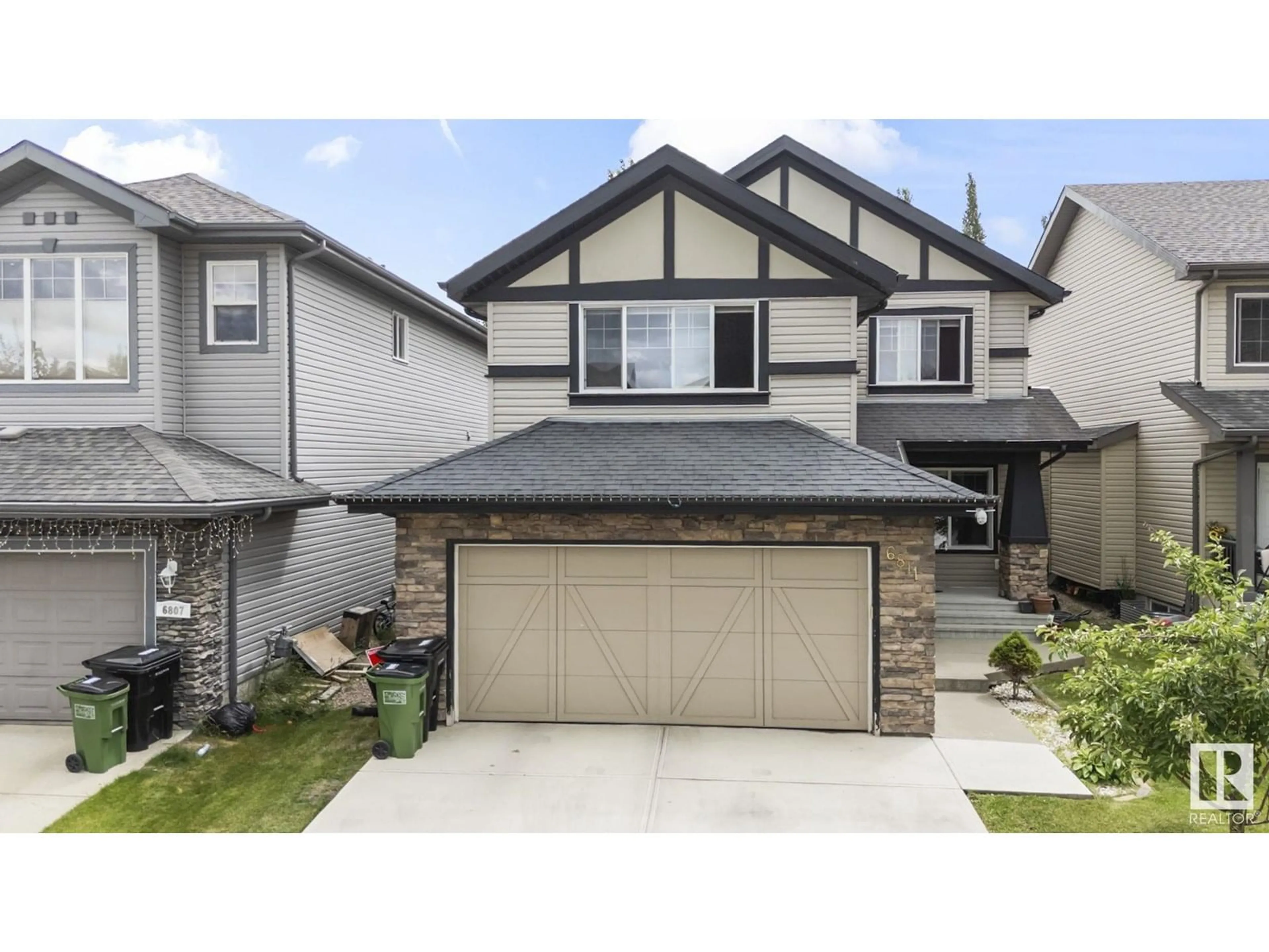 Home with vinyl exterior material, street for 6811 19 AV SW, Edmonton Alberta T6X0L8