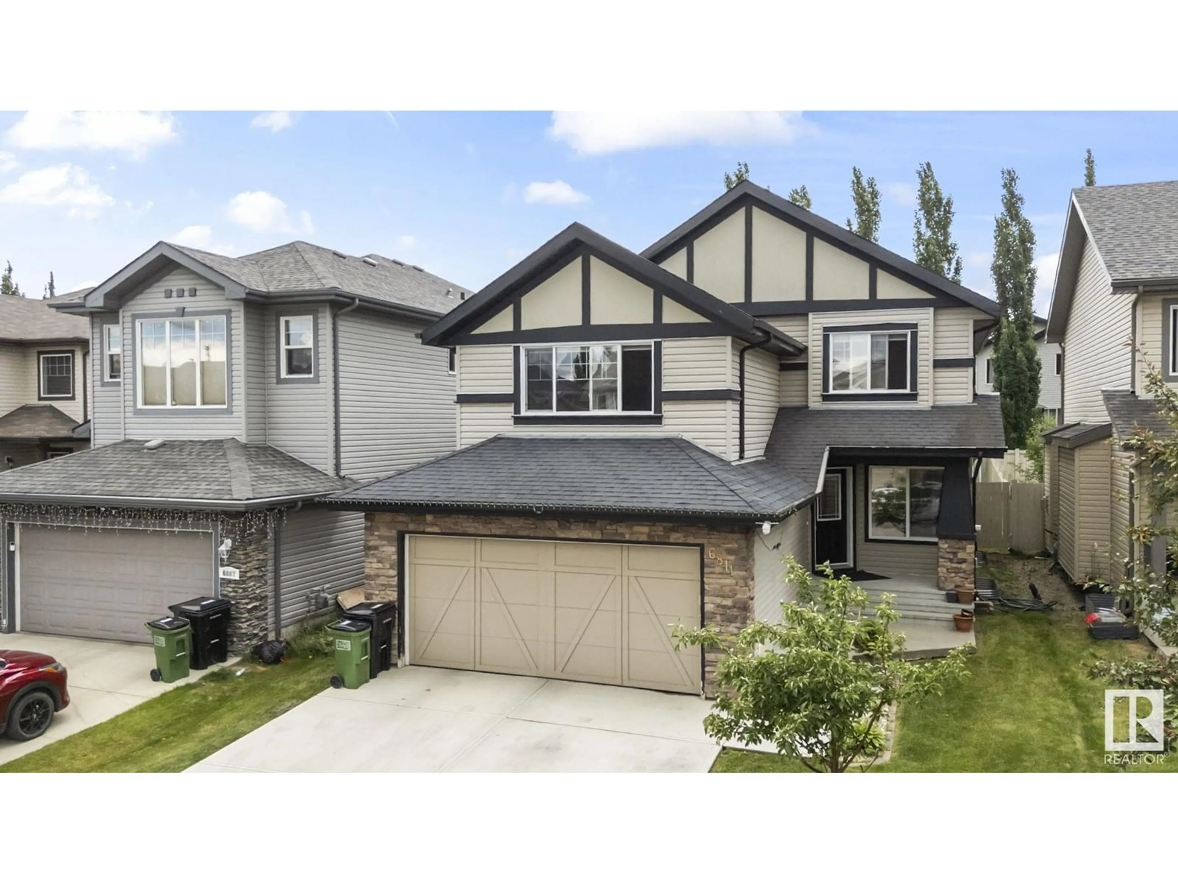 Home with vinyl exterior material, street for 6811 19 AV SW, Edmonton Alberta T6X0L8