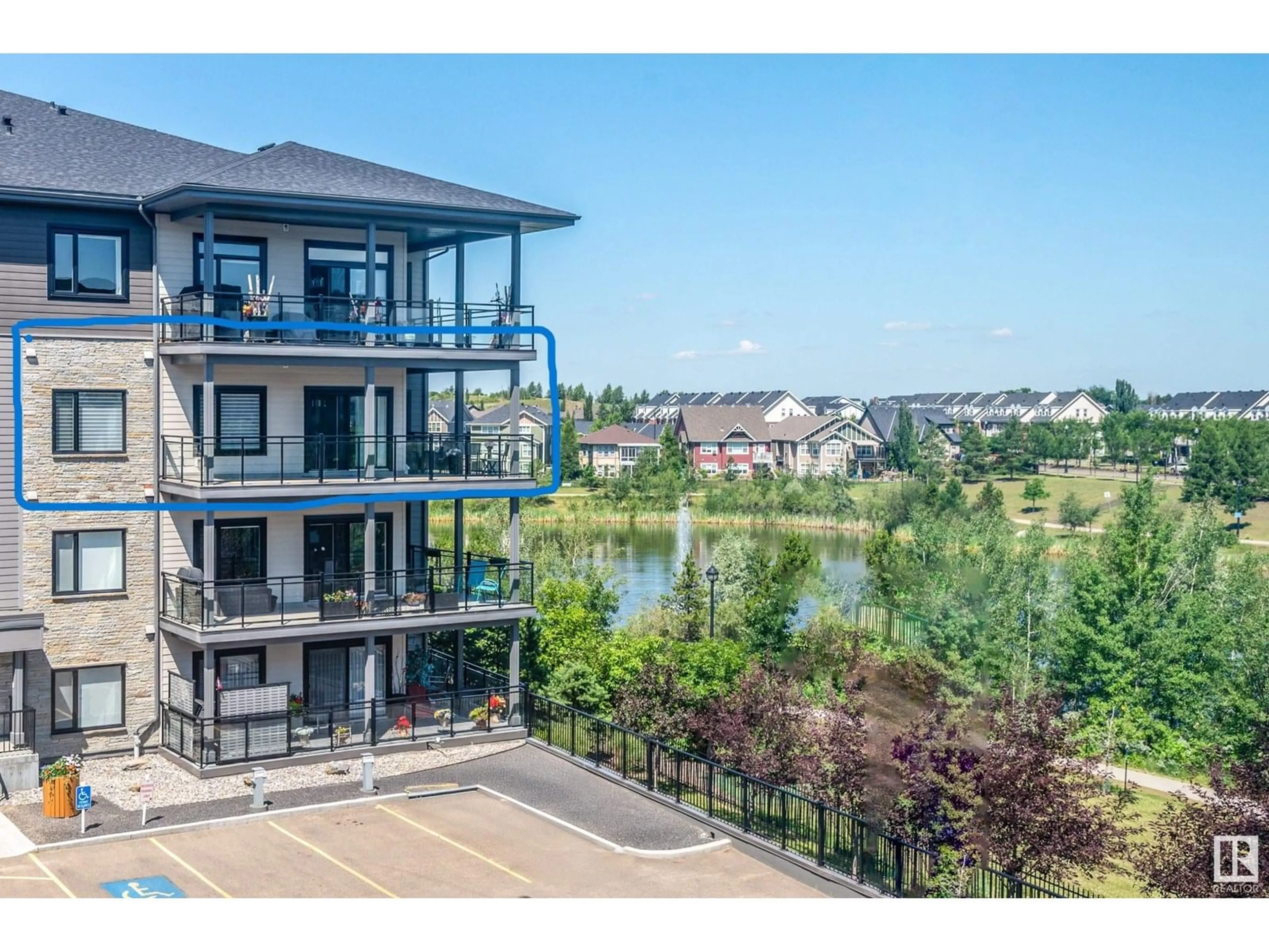A pic from outside/outdoor area/front of a property/back of a property/a pic from drone, water/lake/river/ocean view for 528 - 314 GRIESBACH PARADE, Edmonton Alberta T5E6X2