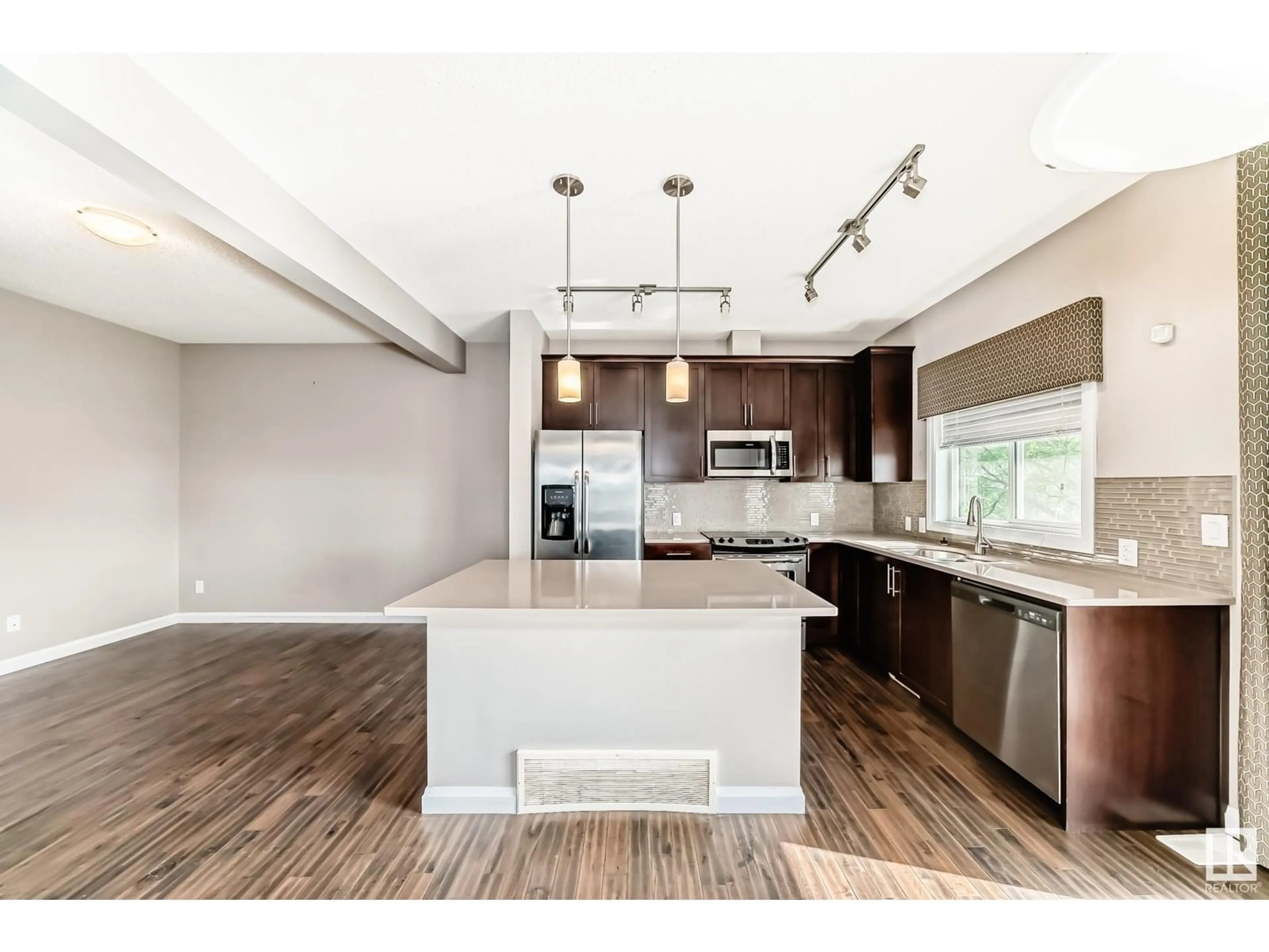 Open concept kitchen, wood/laminate floor for 3710 ALLAN DR, Edmonton Alberta T5H3V9