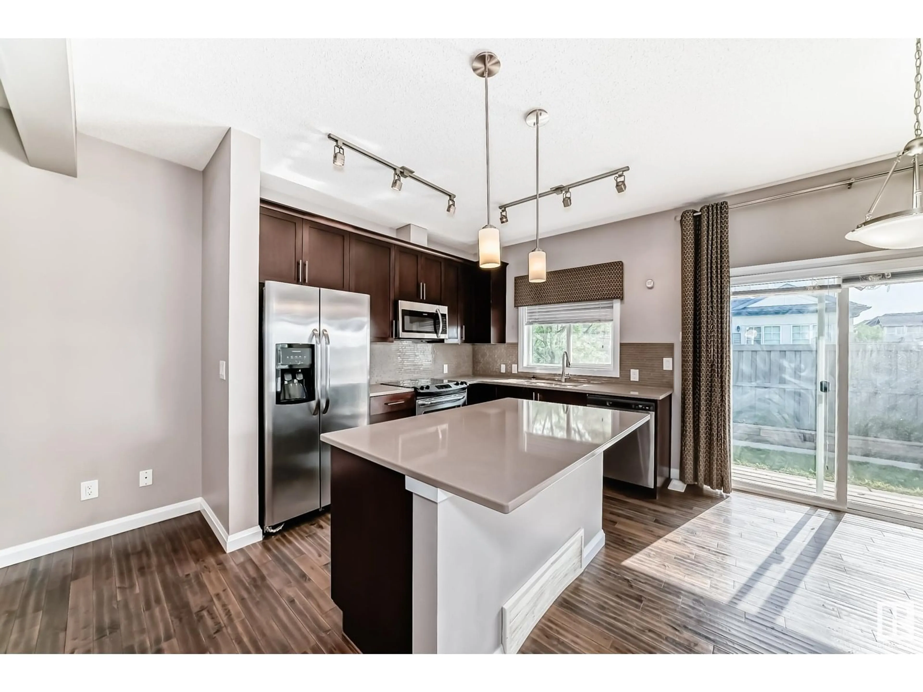 Open concept kitchen, wood/laminate floor for 3710 ALLAN DR, Edmonton Alberta T5H3V9