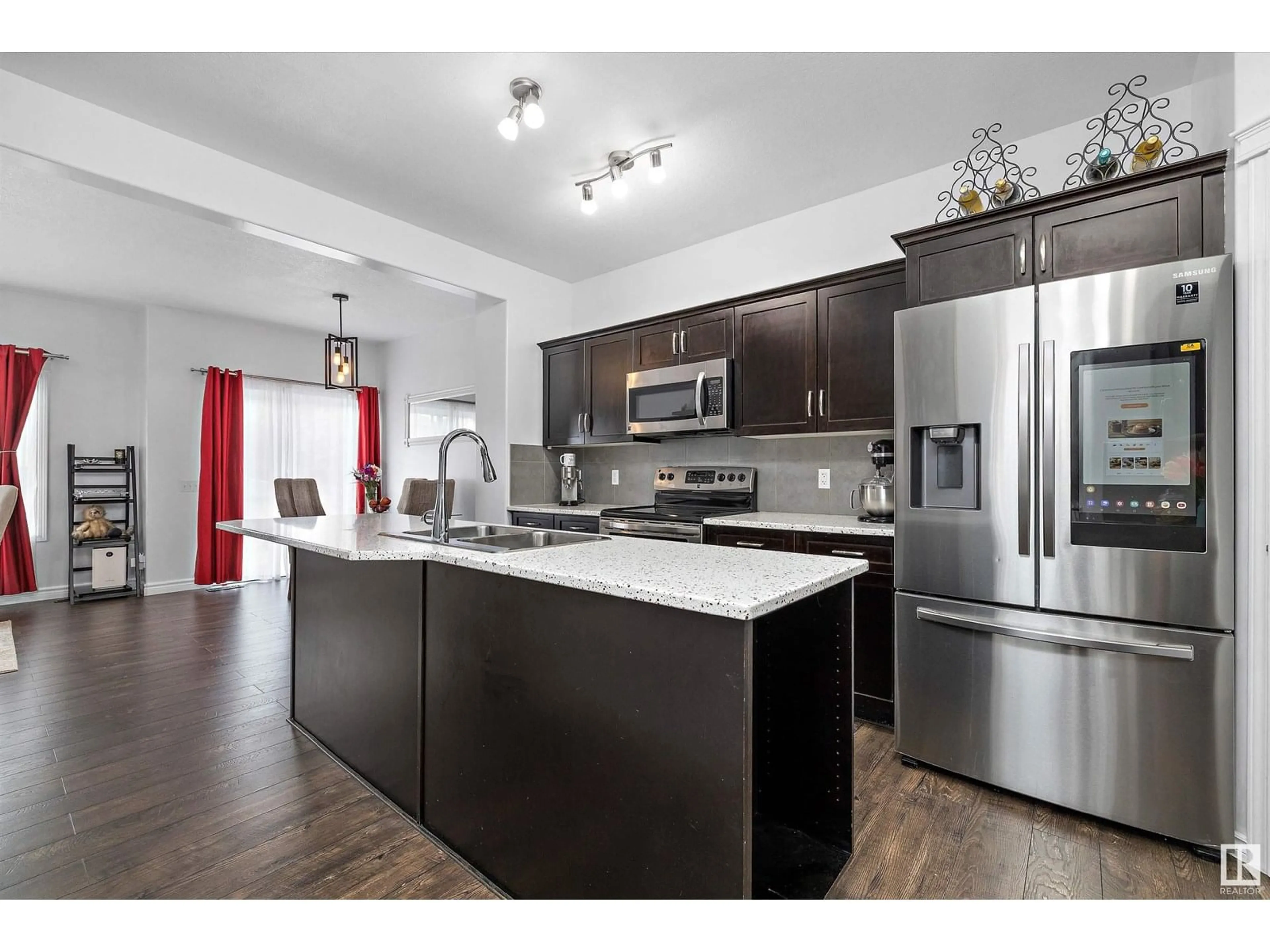 Open concept kitchen, wood/laminate floor for 18032 85 ST, Edmonton Alberta T5Z0E4