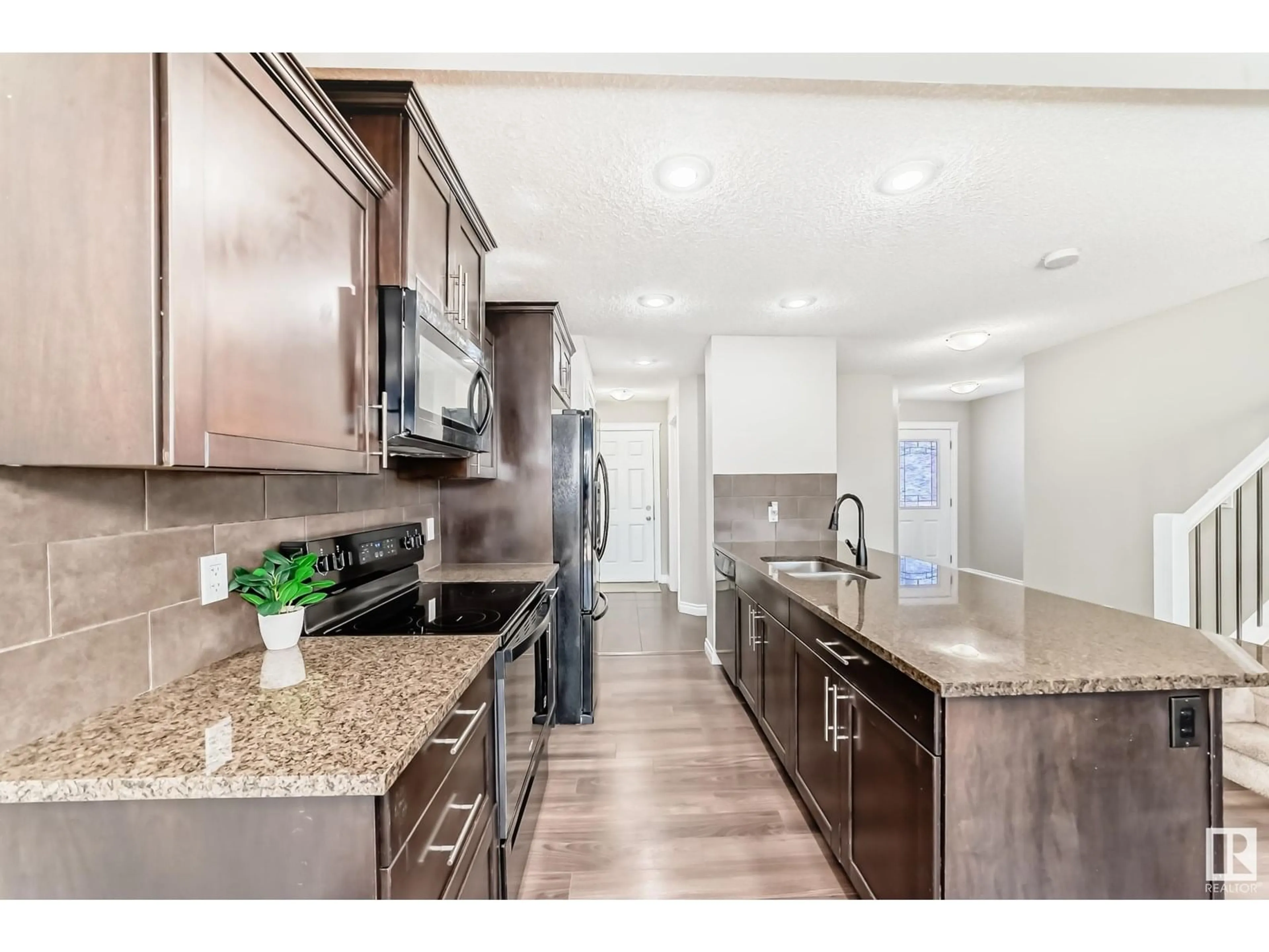 Open concept kitchen, ceramic/tile floor for 5406 14 AV, Edmonton Alberta T6X1S2