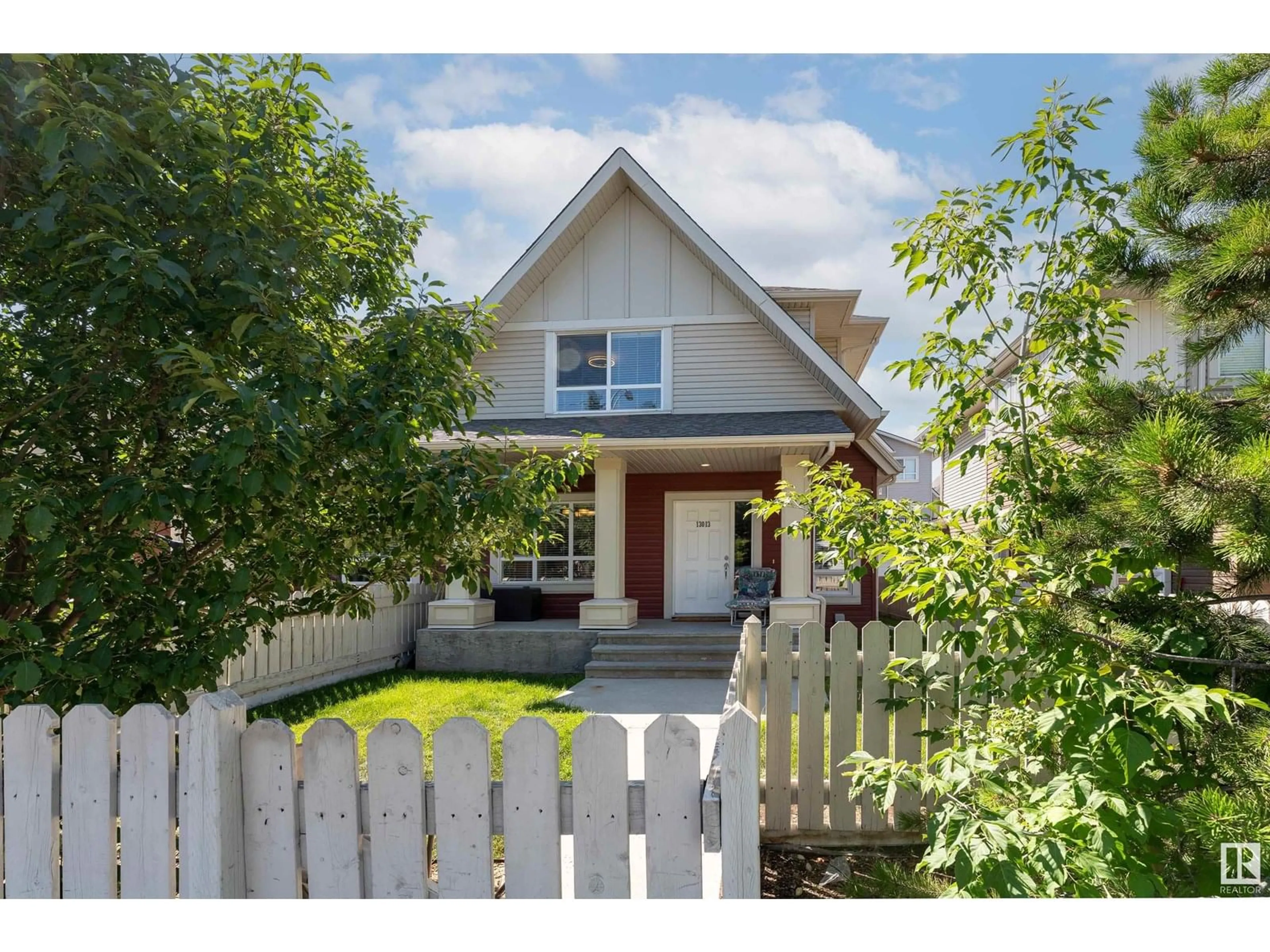 Home with vinyl exterior material, street for 13013 132 AV, Edmonton Alberta T5L3R2