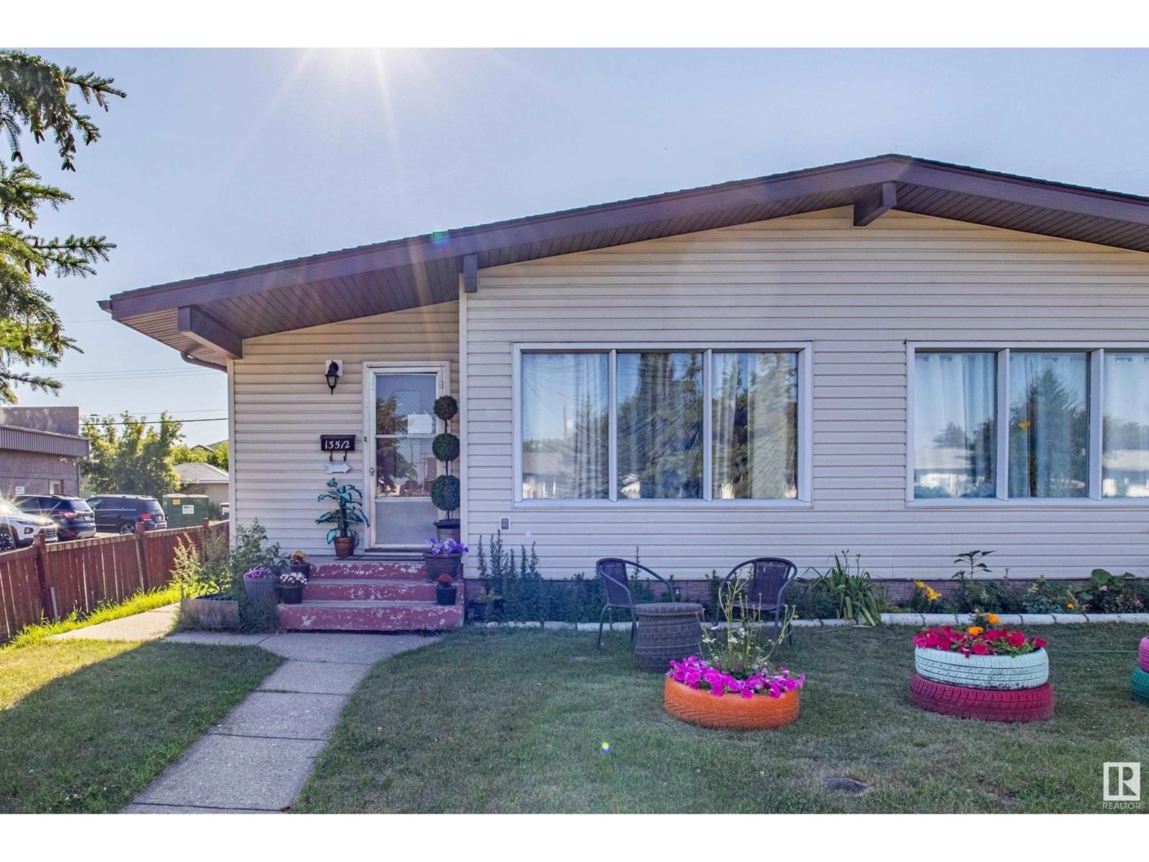 Home with vinyl exterior material, street for NW - 13512 127 ST, Edmonton Alberta T5L1B9