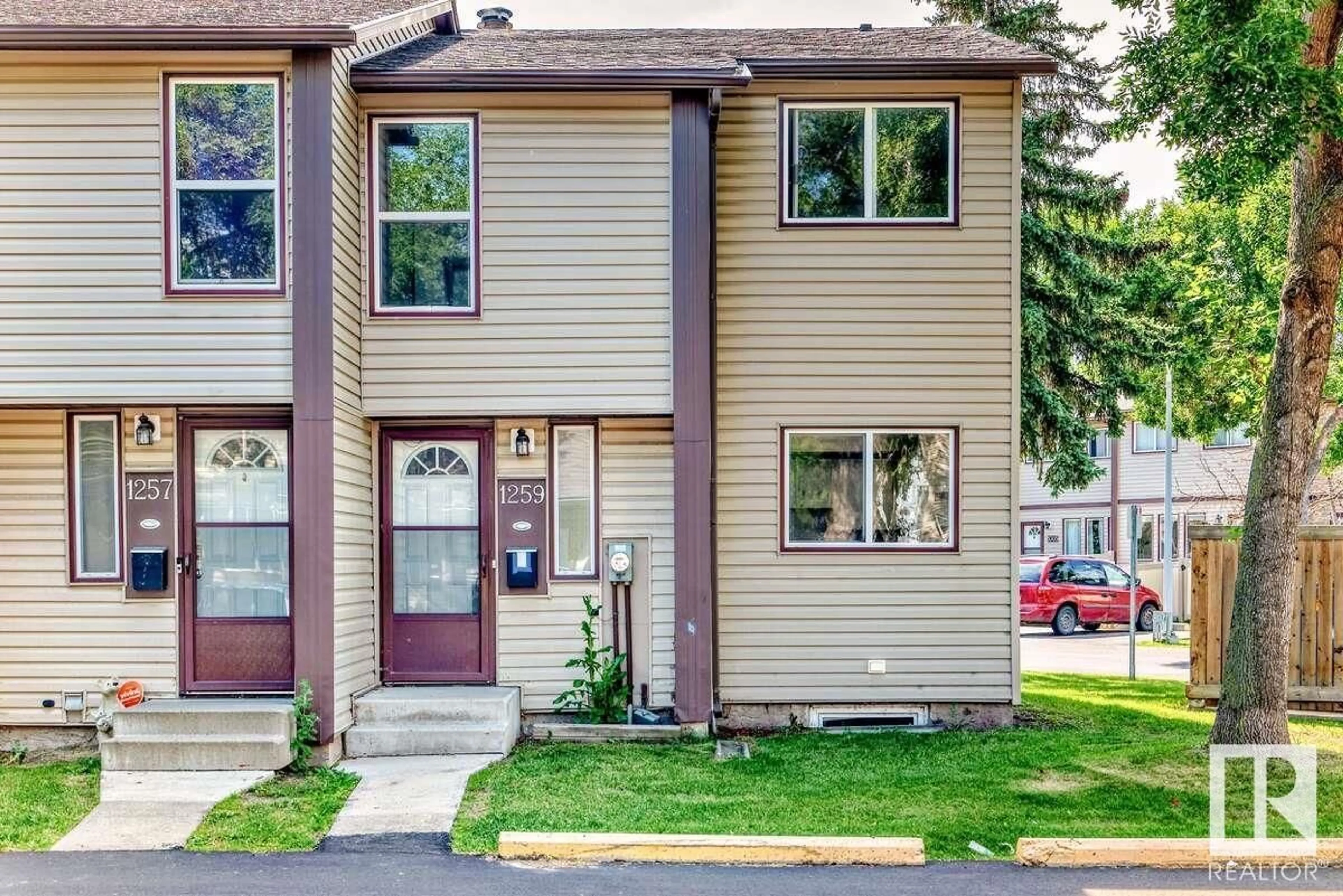 Home with vinyl exterior material, street for 1259 HOOKE RD, Edmonton Alberta T5A4A4