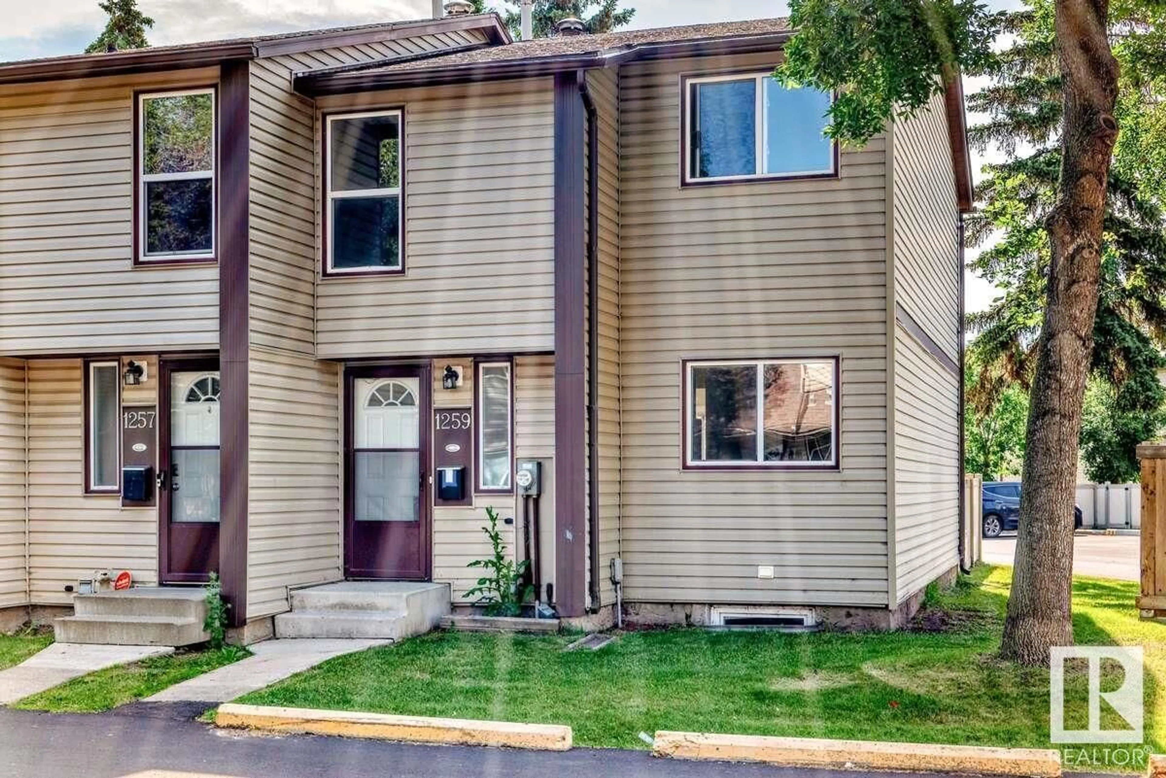 Home with vinyl exterior material, street for 1259 HOOKE RD, Edmonton Alberta T5A4A4