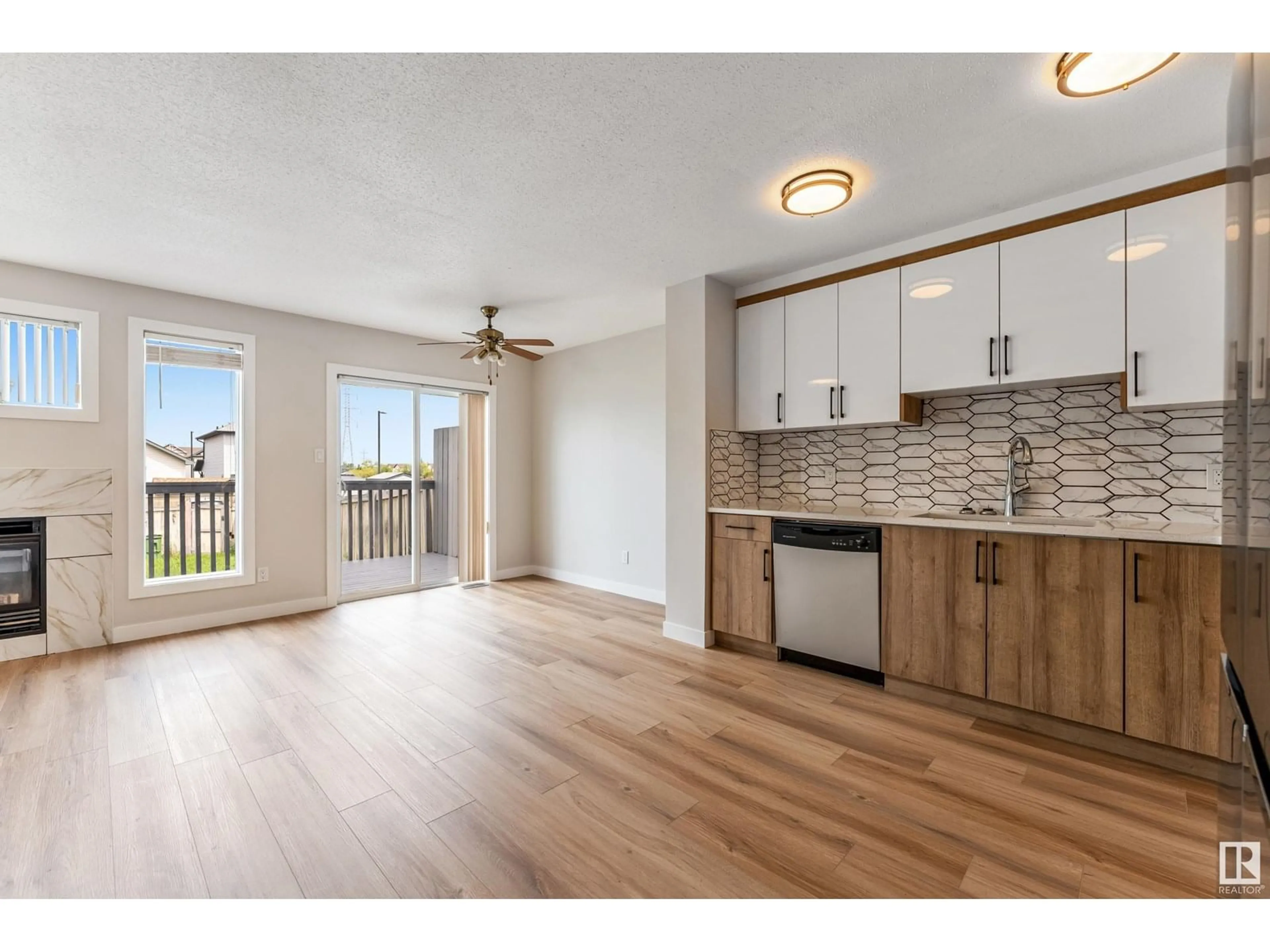 Open concept kitchen, wood/laminate floor for 3008 31 AV, Edmonton Alberta T6T1W9