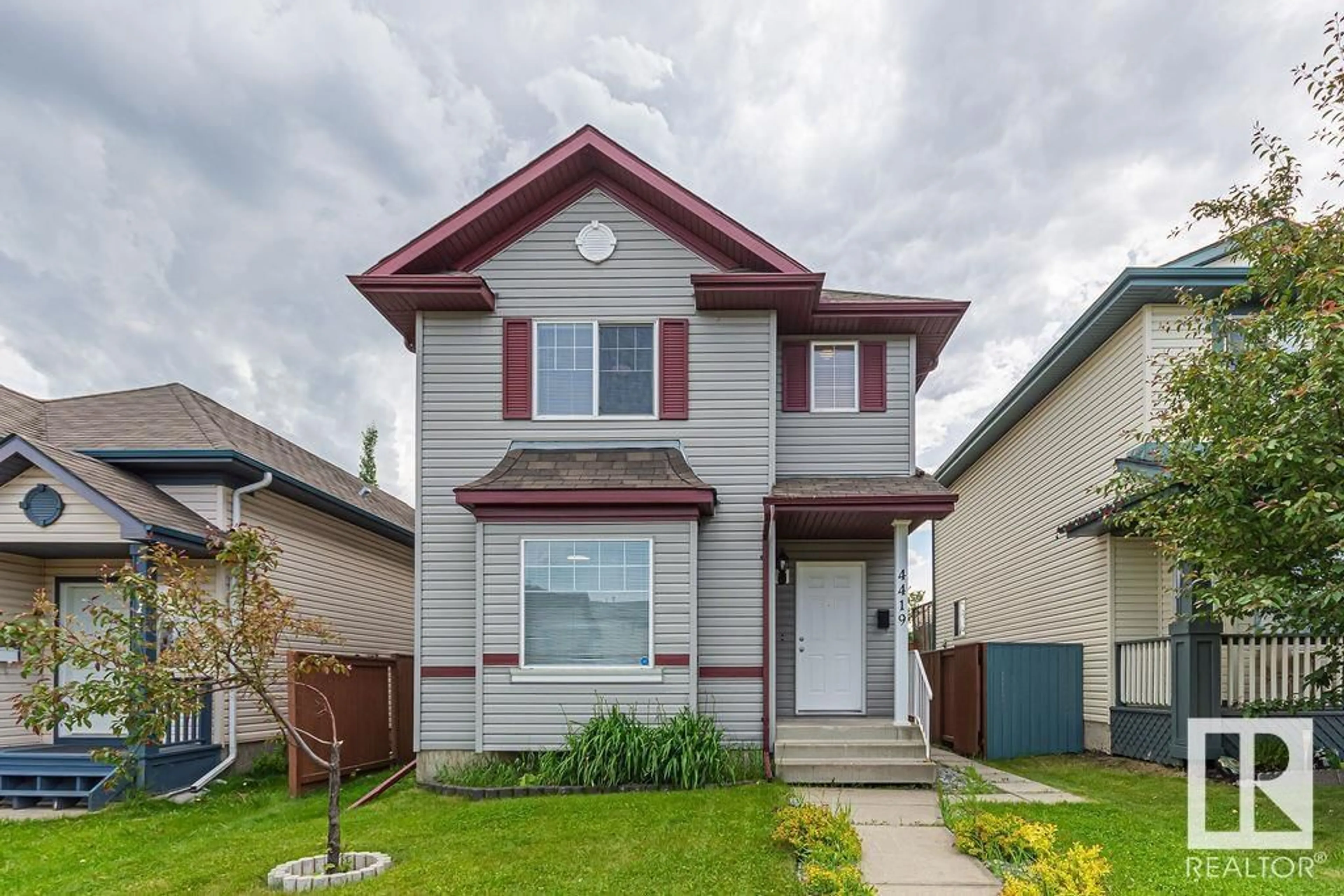 Home with vinyl exterior material, street for 4419 152 AV, Edmonton Alberta T5Y3C3