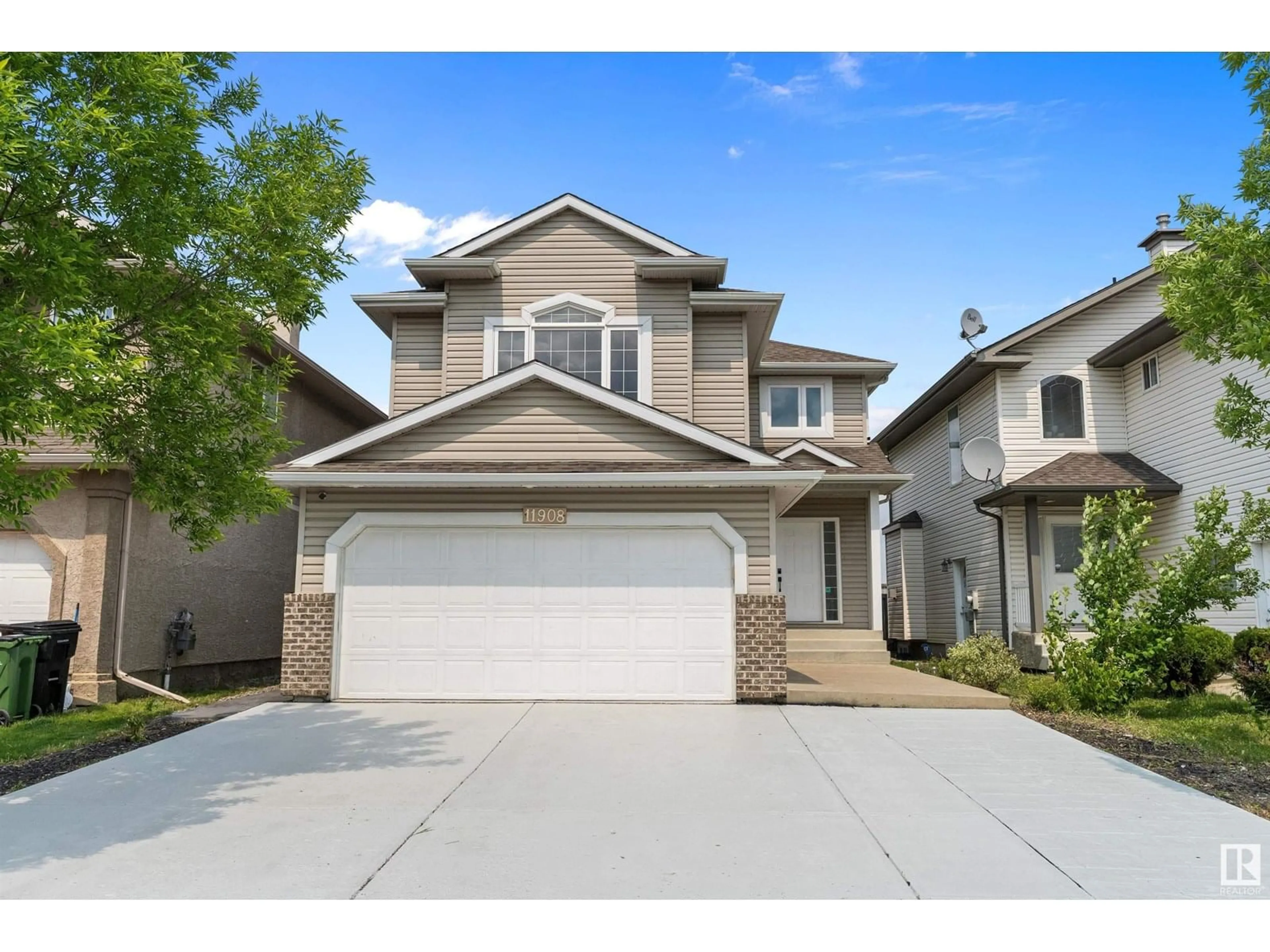 Home with vinyl exterior material, street for 11908 175 AV, Edmonton Alberta T5X0A5