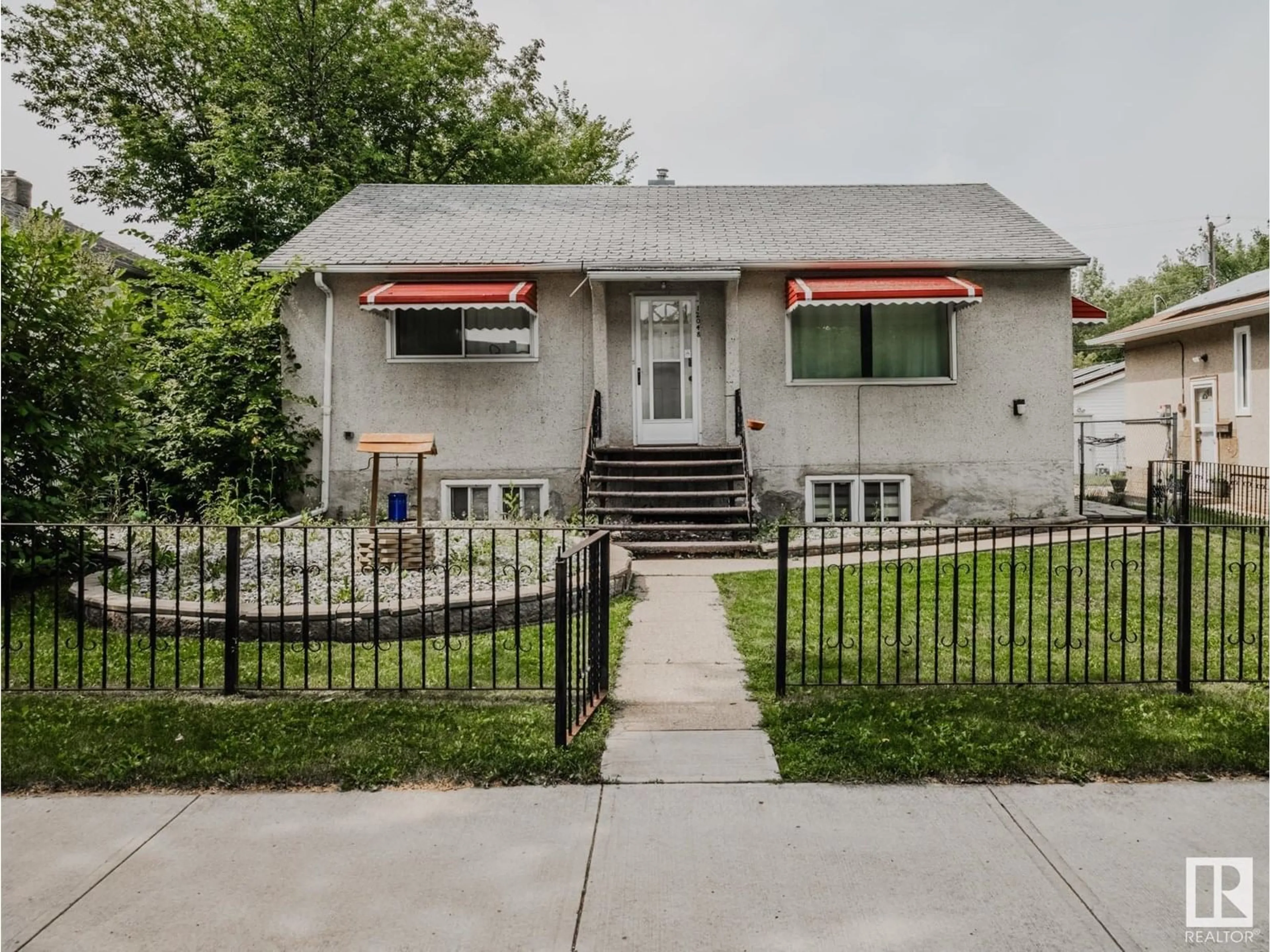 Home with vinyl exterior material, street for NW - 12048 61 ST, Edmonton Alberta T5W4B1