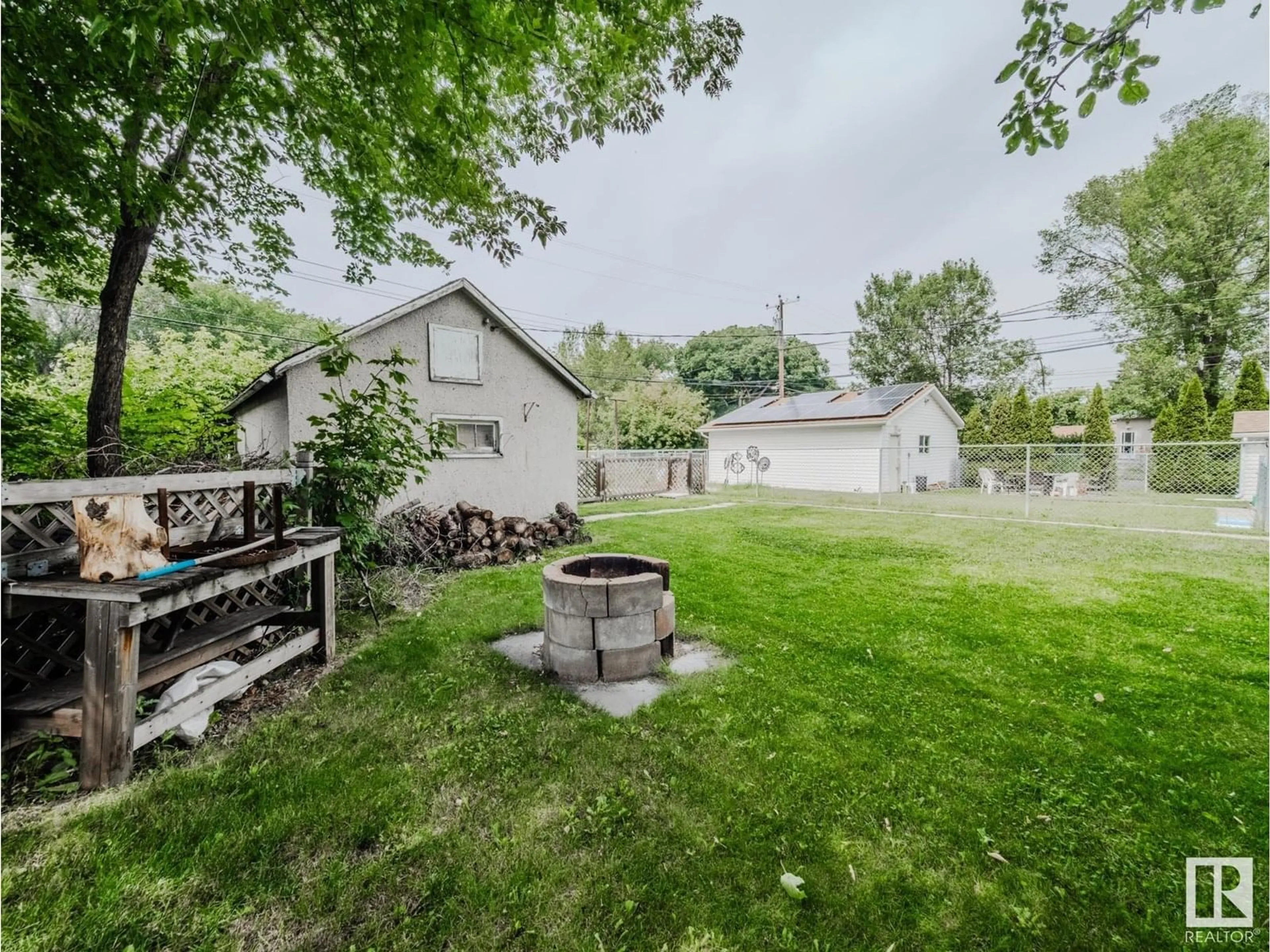 A pic from outside/outdoor area/front of a property/back of a property/a pic from drone, water/lake/river/ocean view for NW - 12048 61 ST, Edmonton Alberta T5W4B1