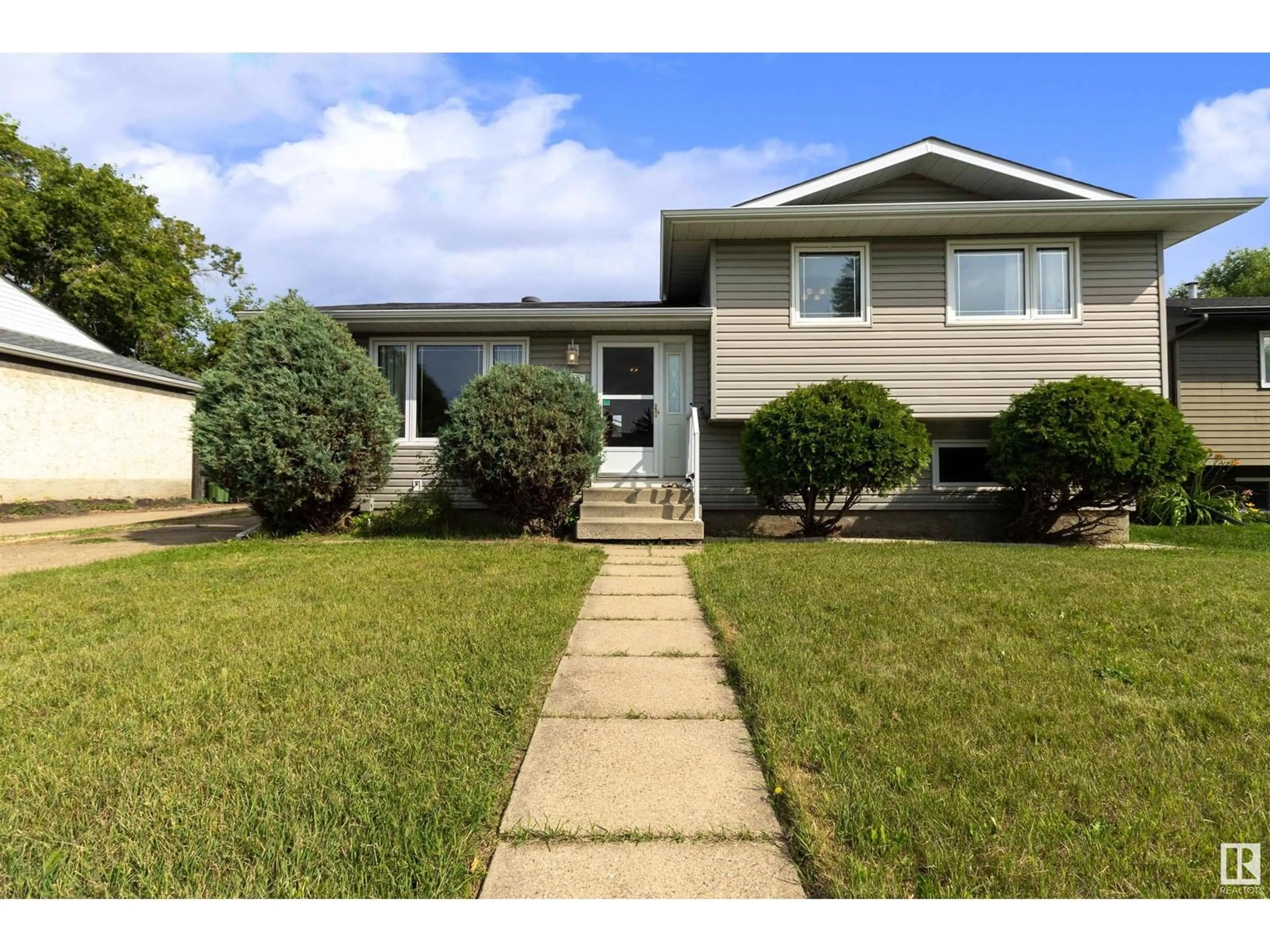Home with vinyl exterior material, street for 2610 129A AV, Edmonton Alberta T5A3Y1