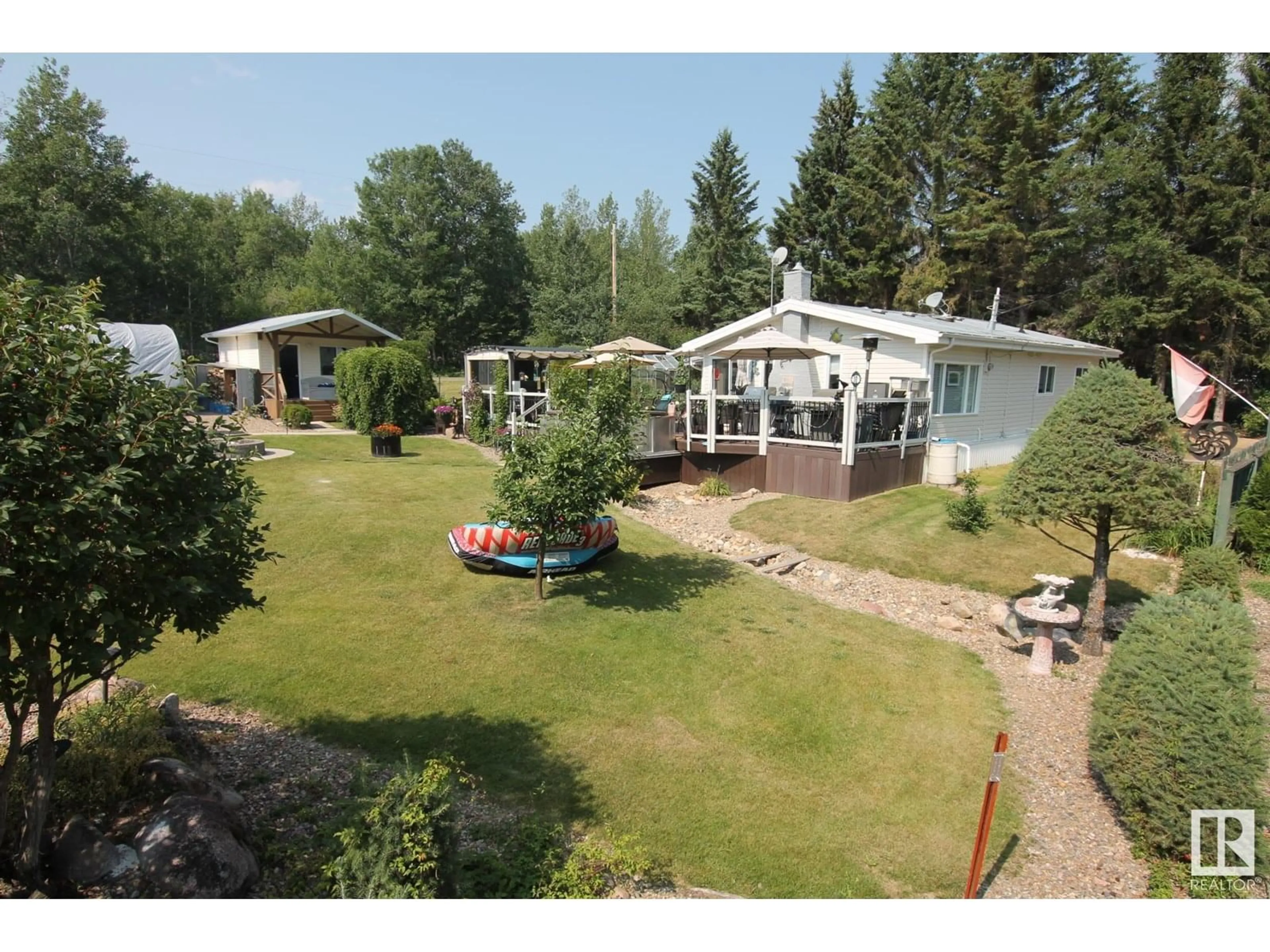 A pic from outside/outdoor area/front of a property/back of a property/a pic from drone, water/lake/river/ocean view for 64 ROBIN LN, Rural Athabasca County Alberta T0A0M0