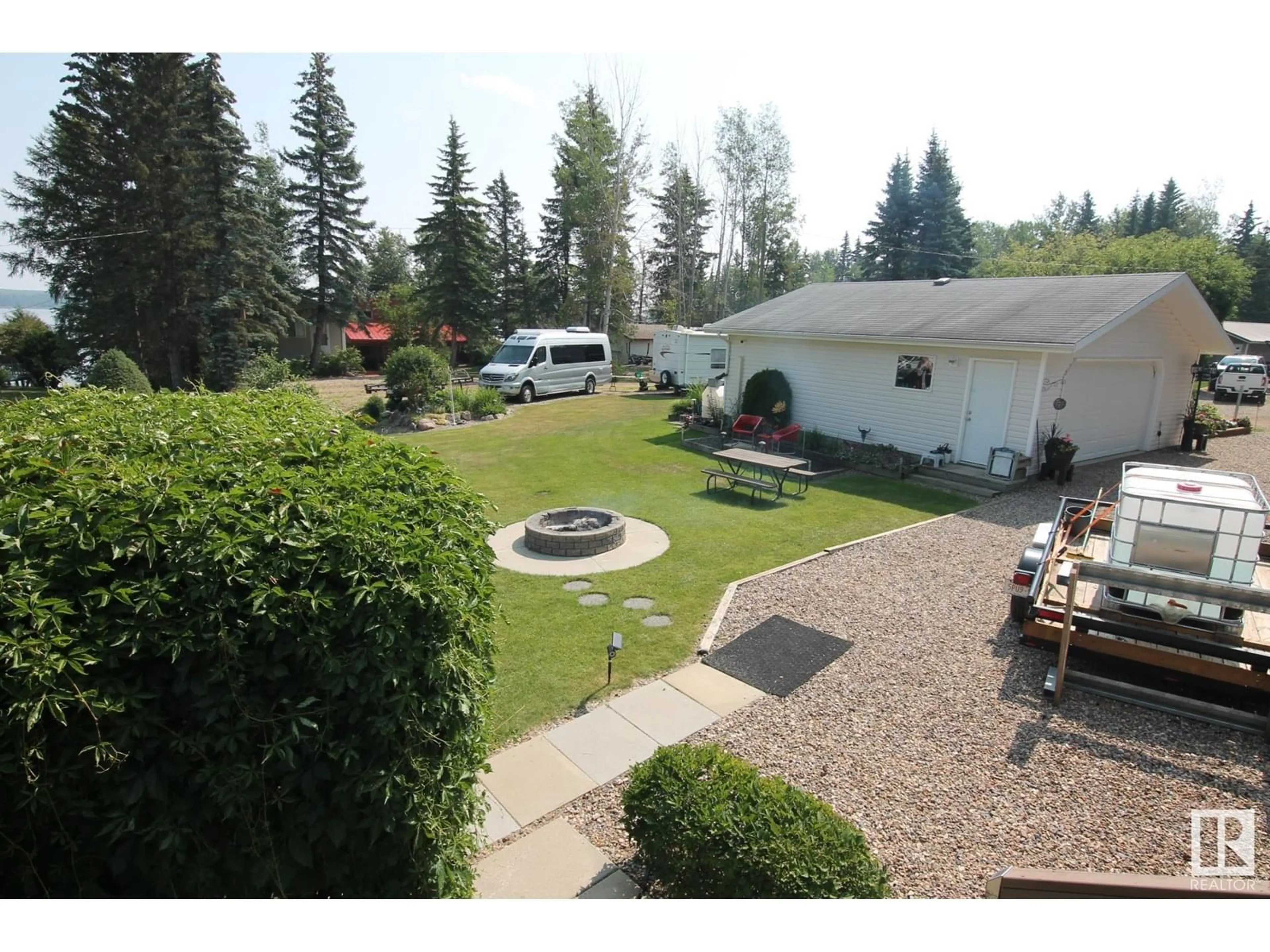 A pic from outside/outdoor area/front of a property/back of a property/a pic from drone, mountain view for 64 ROBIN LN, Rural Athabasca County Alberta T0A0M0