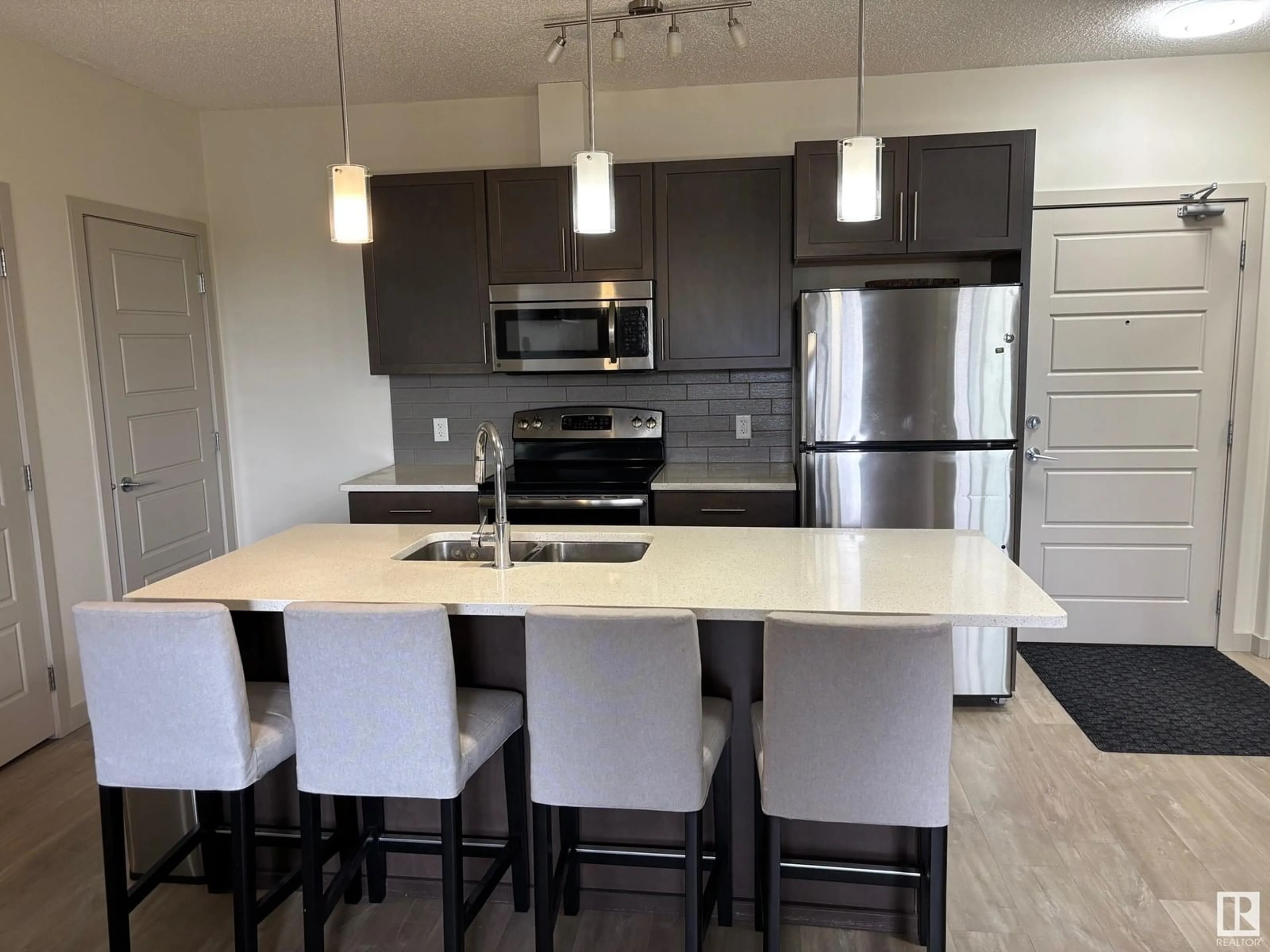 Open concept kitchen, unknown for 215 - 1004 ROSENTHAL BV, Edmonton Alberta T5T7C6
