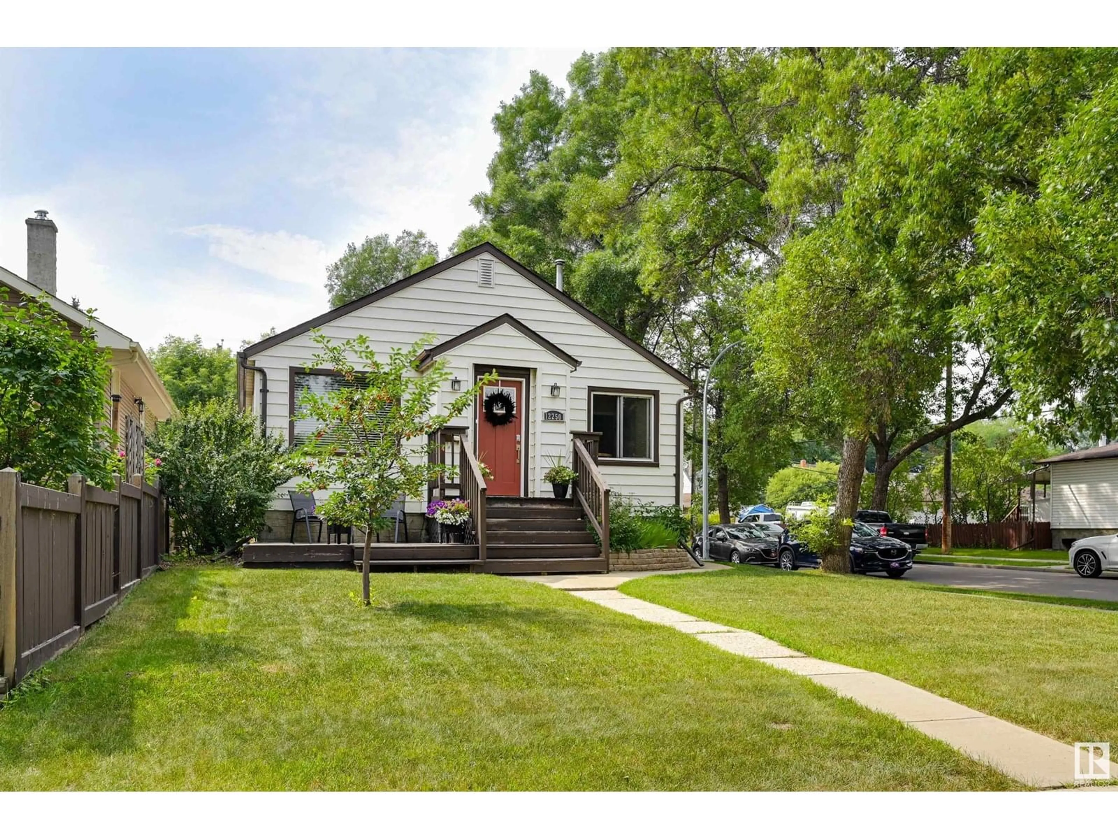 Home with vinyl exterior material, street for 12250 103 ST, Edmonton Alberta T5G2K1