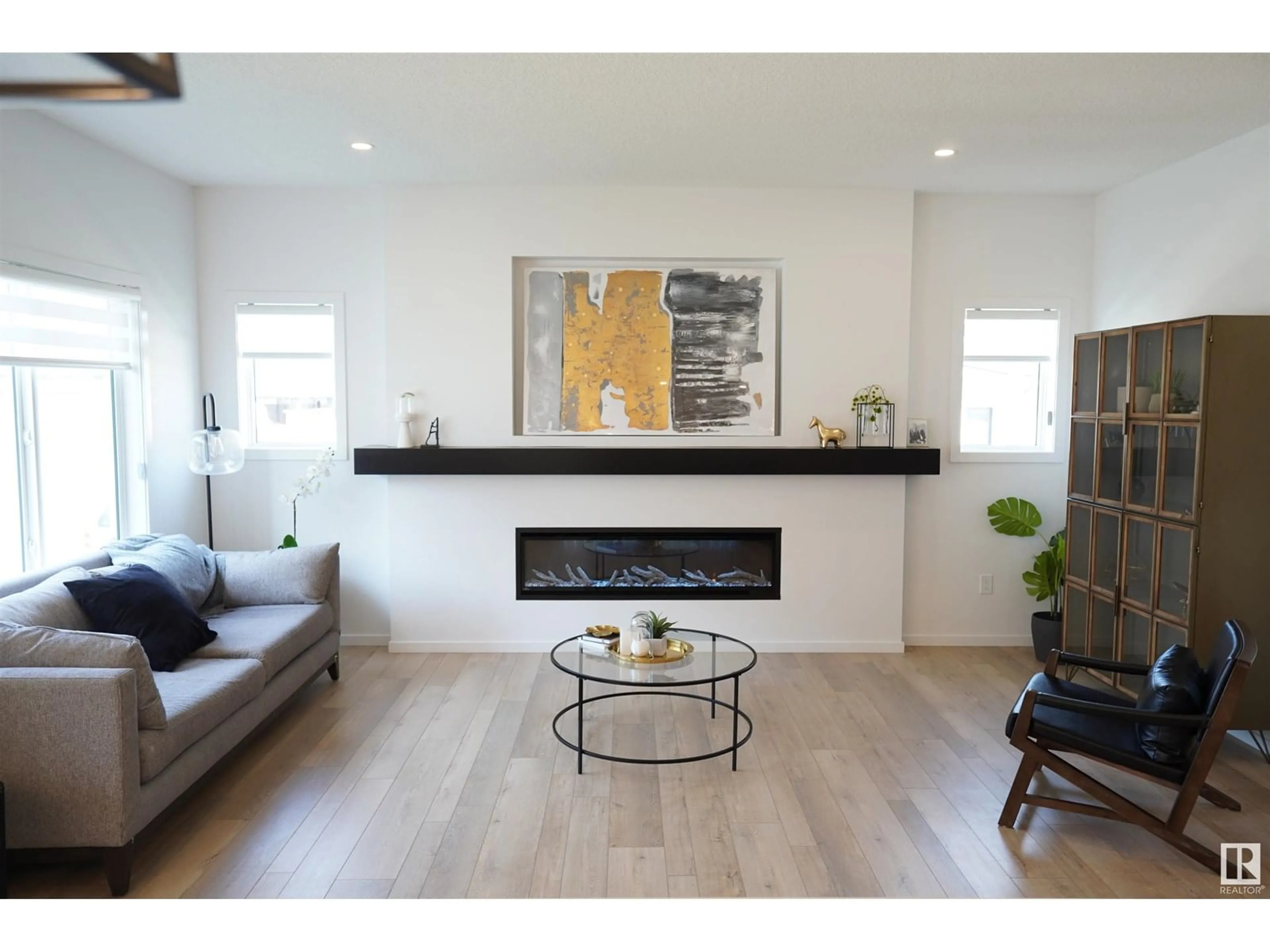 Living room with furniture, wood/laminate floor for 5557 SCHONSEE DR, Edmonton Alberta T5Z0R8