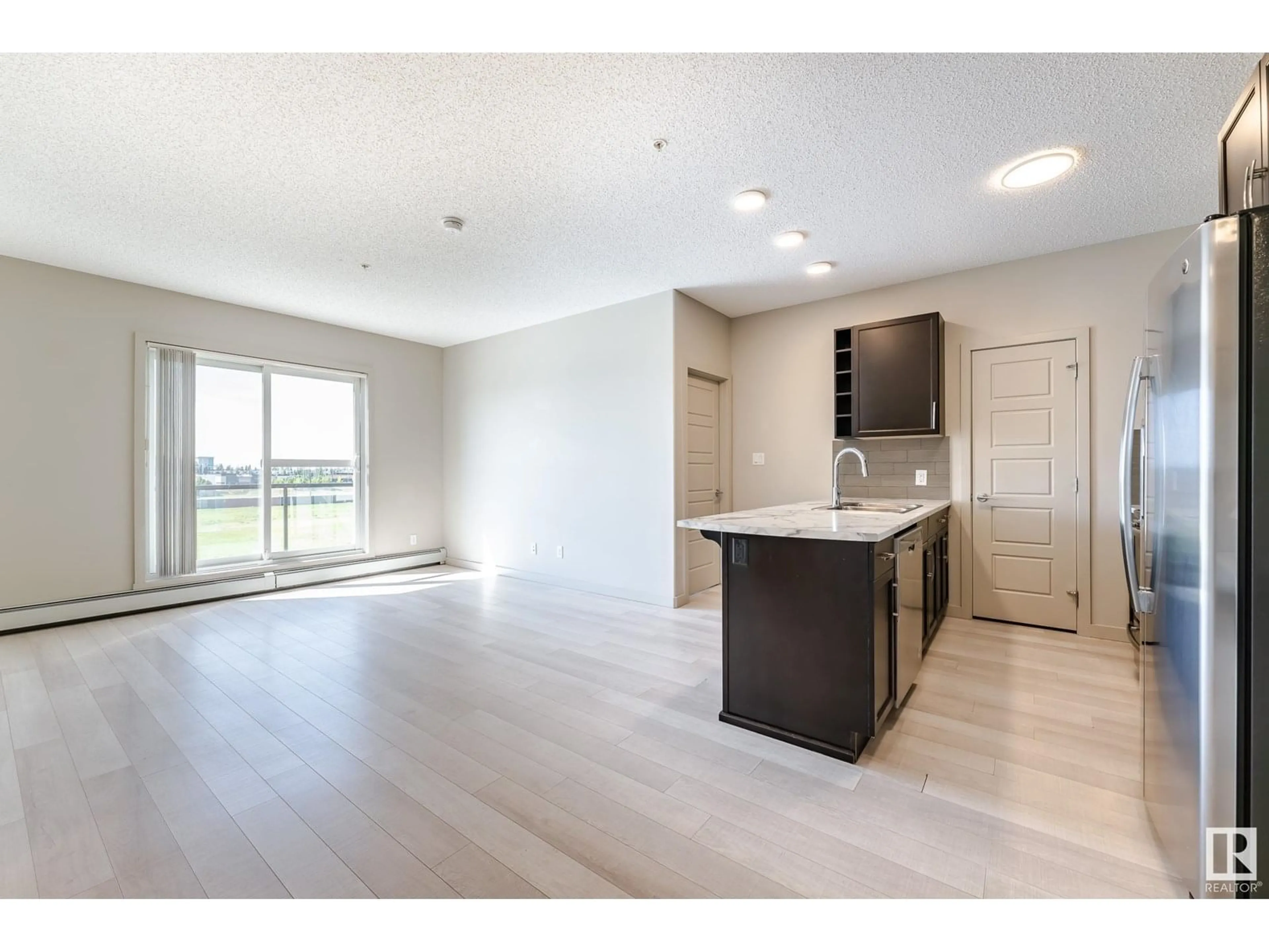 Open concept kitchen, unknown for 408 - 320 AMBLESIDE LI, Edmonton Alberta T6W2Z9