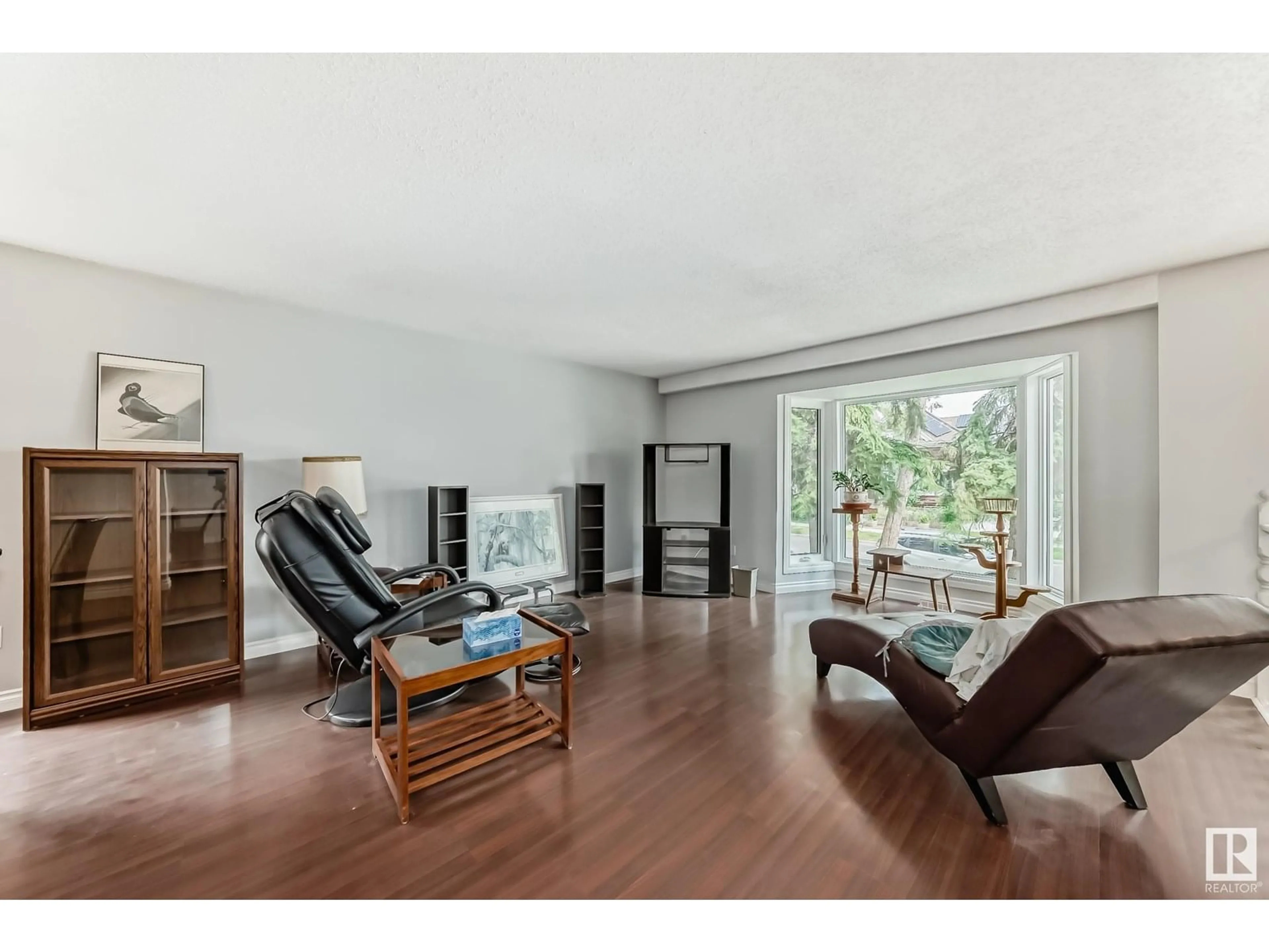 Living room with furniture, wood/laminate floor for 11240 95A ST, Edmonton Alberta T5G1N8
