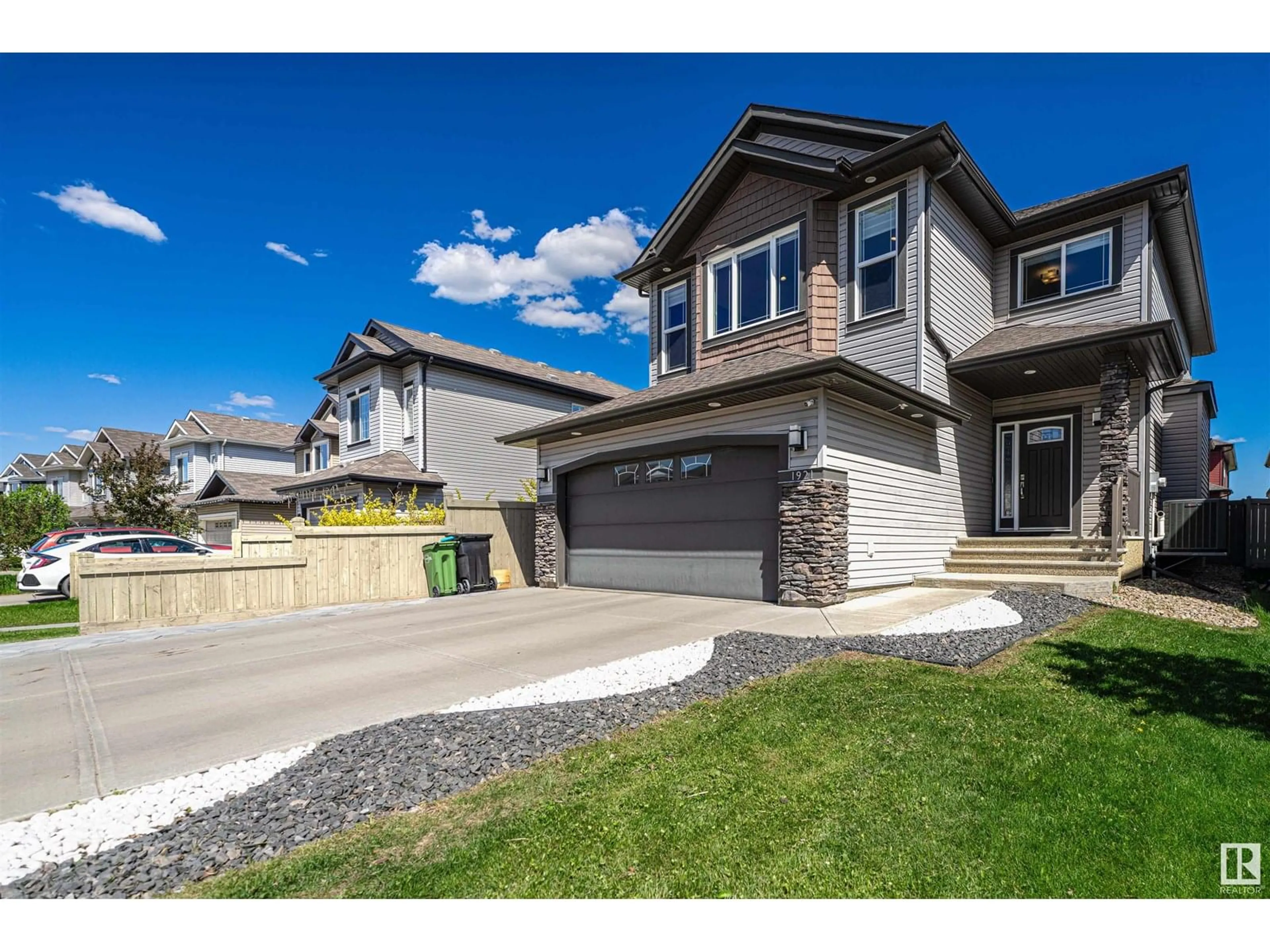 Home with vinyl exterior material, street for 1921 33 ST, Edmonton Alberta T6T0L5