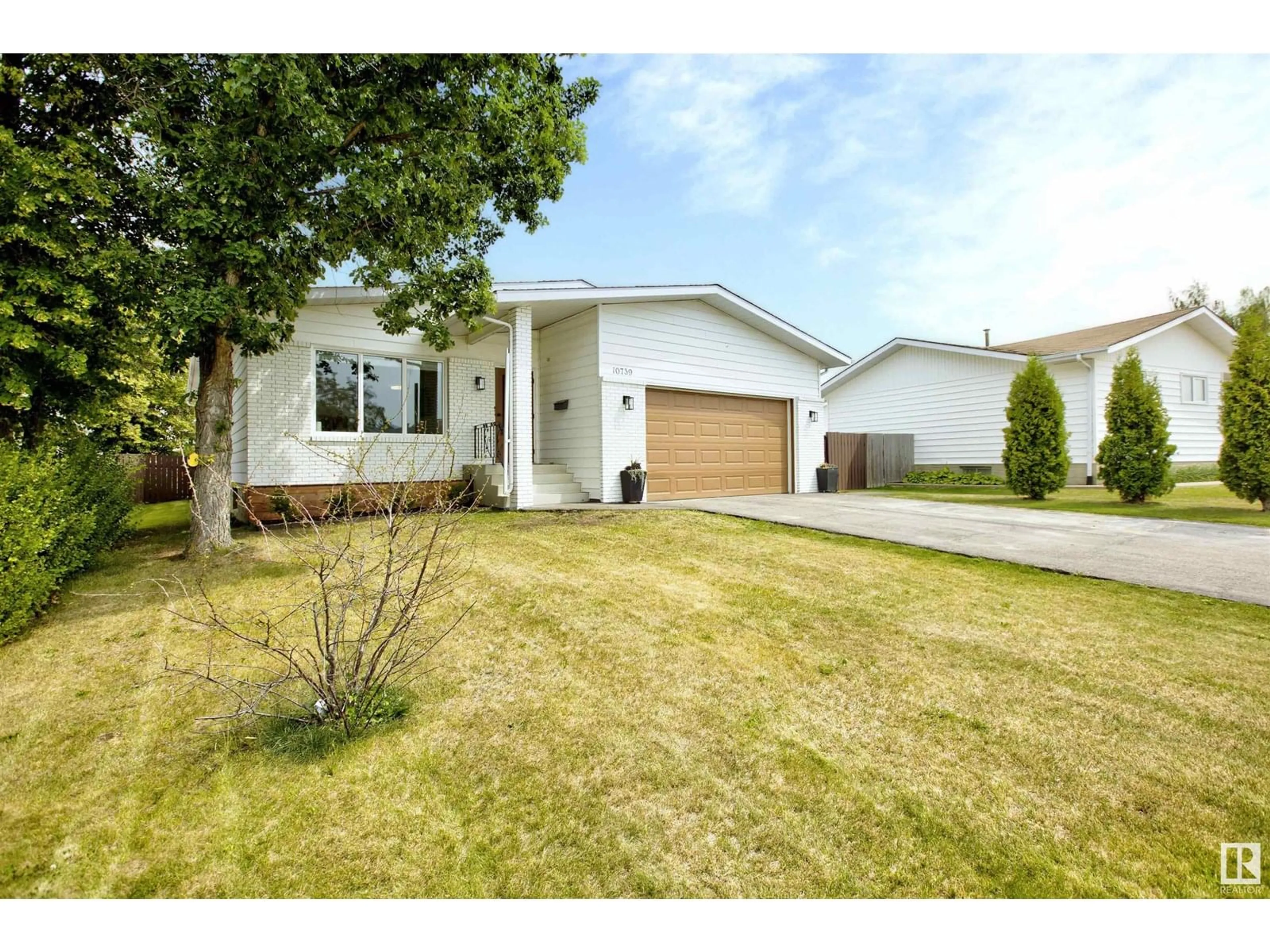 Home with vinyl exterior material, street for 10739 108 AV, Westlock Alberta T7P1C7