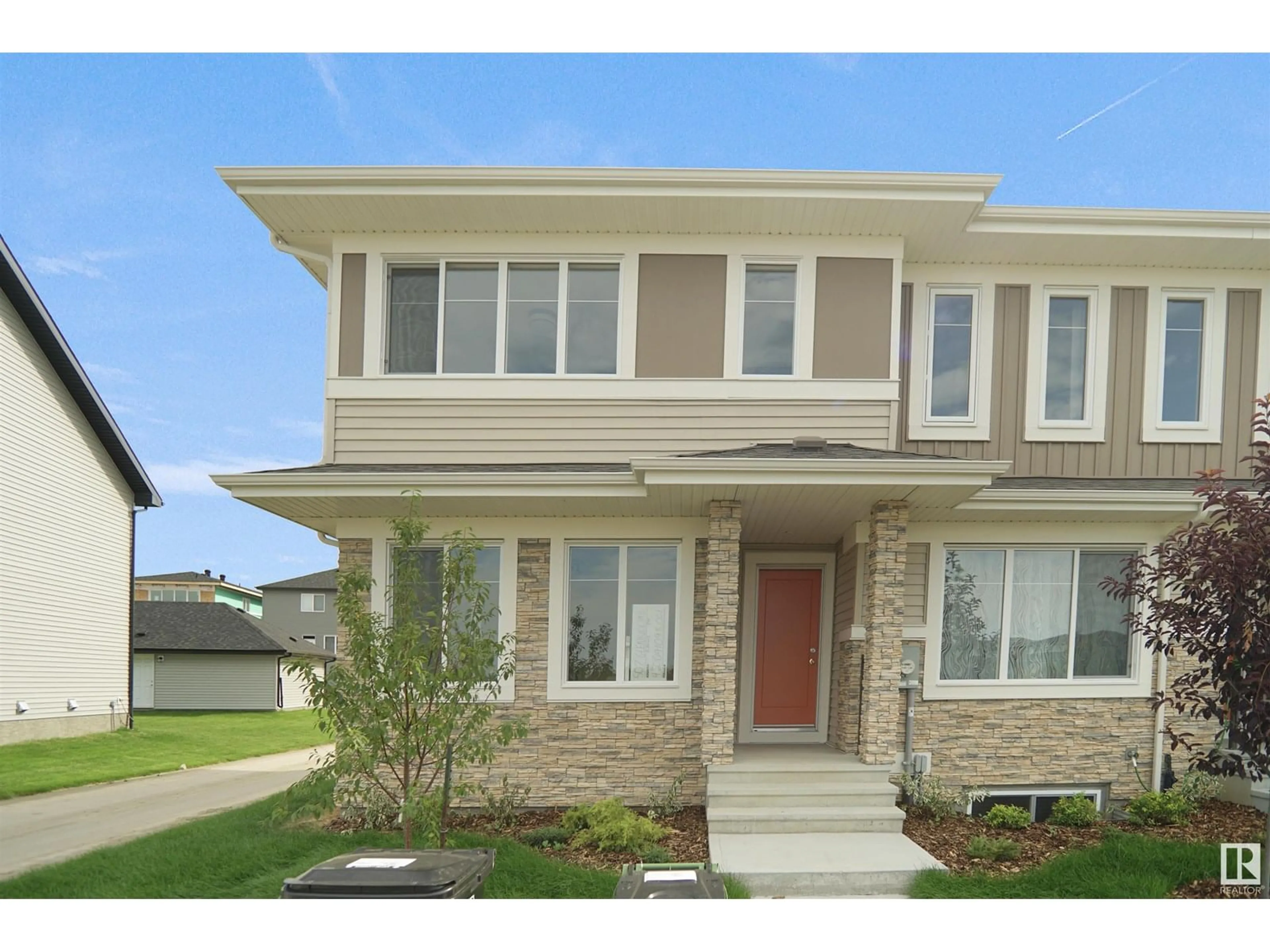 Home with brick exterior material, street for 19445 22 AV, Edmonton Alberta T6M3J3