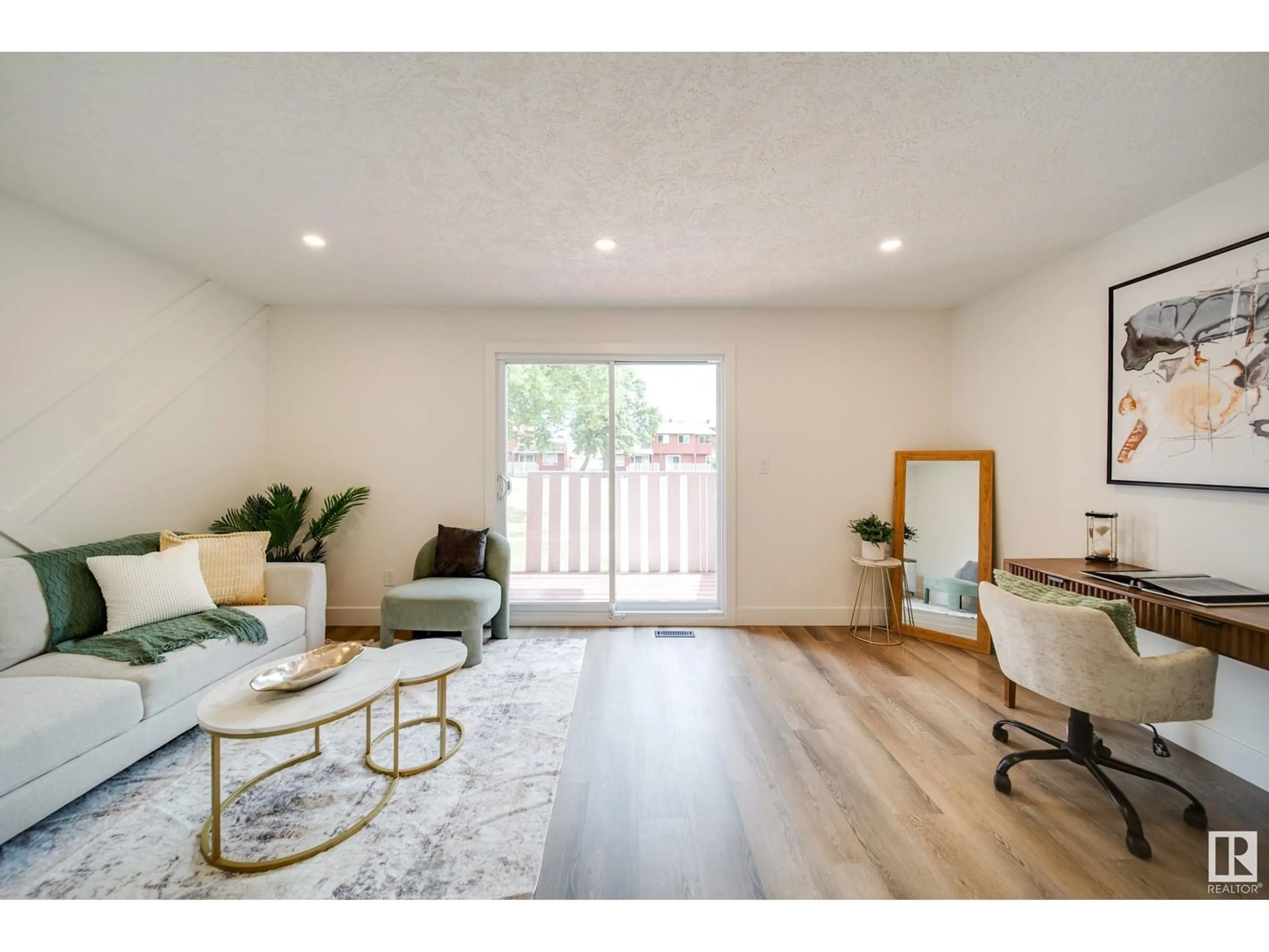 Living room with furniture, wood/laminate floor for 10630 BEAUMARIS RD, Edmonton Alberta T5X3N4