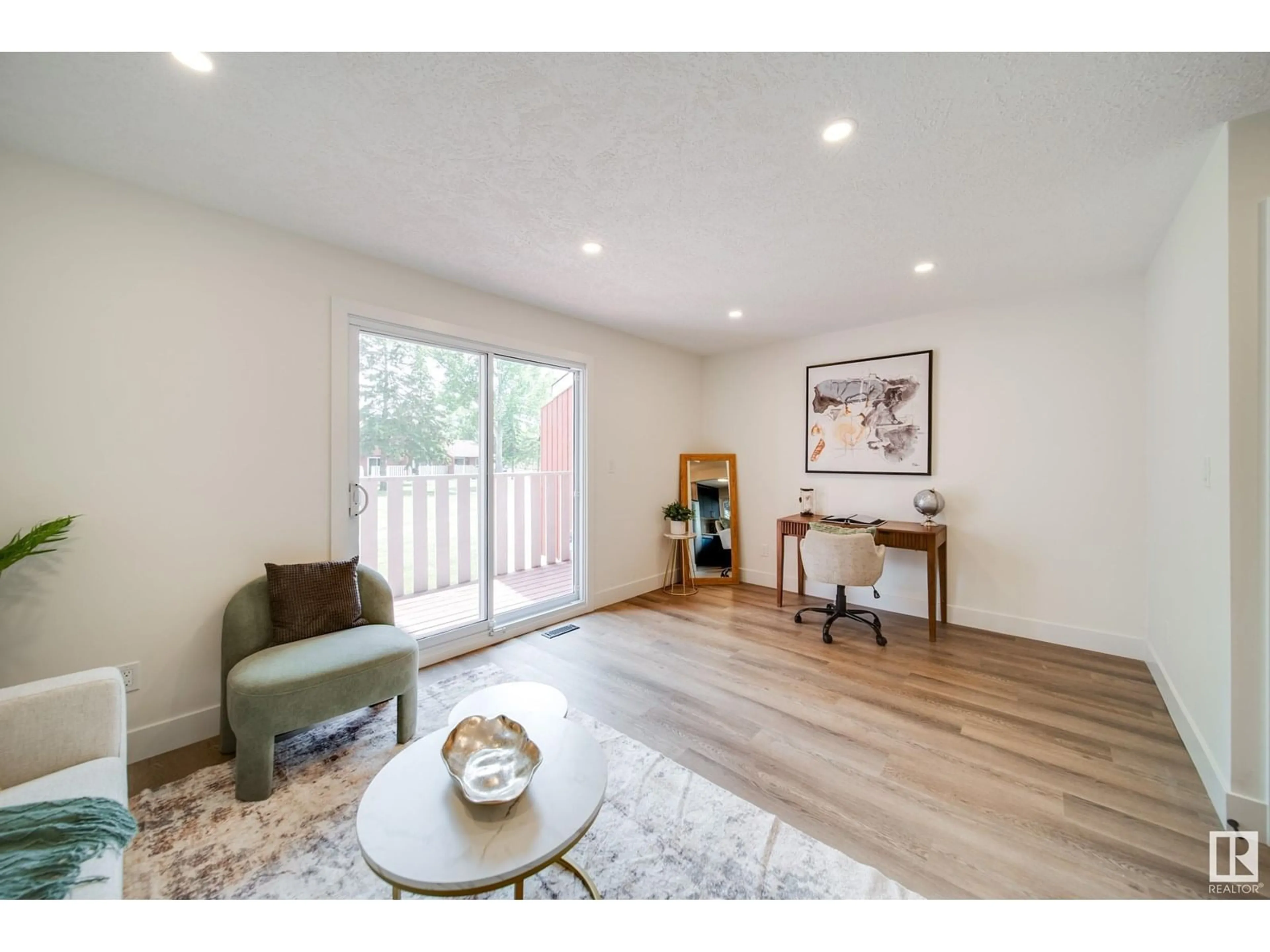 Living room with furniture, wood/laminate floor for 10630 BEAUMARIS RD, Edmonton Alberta T5X3N4
