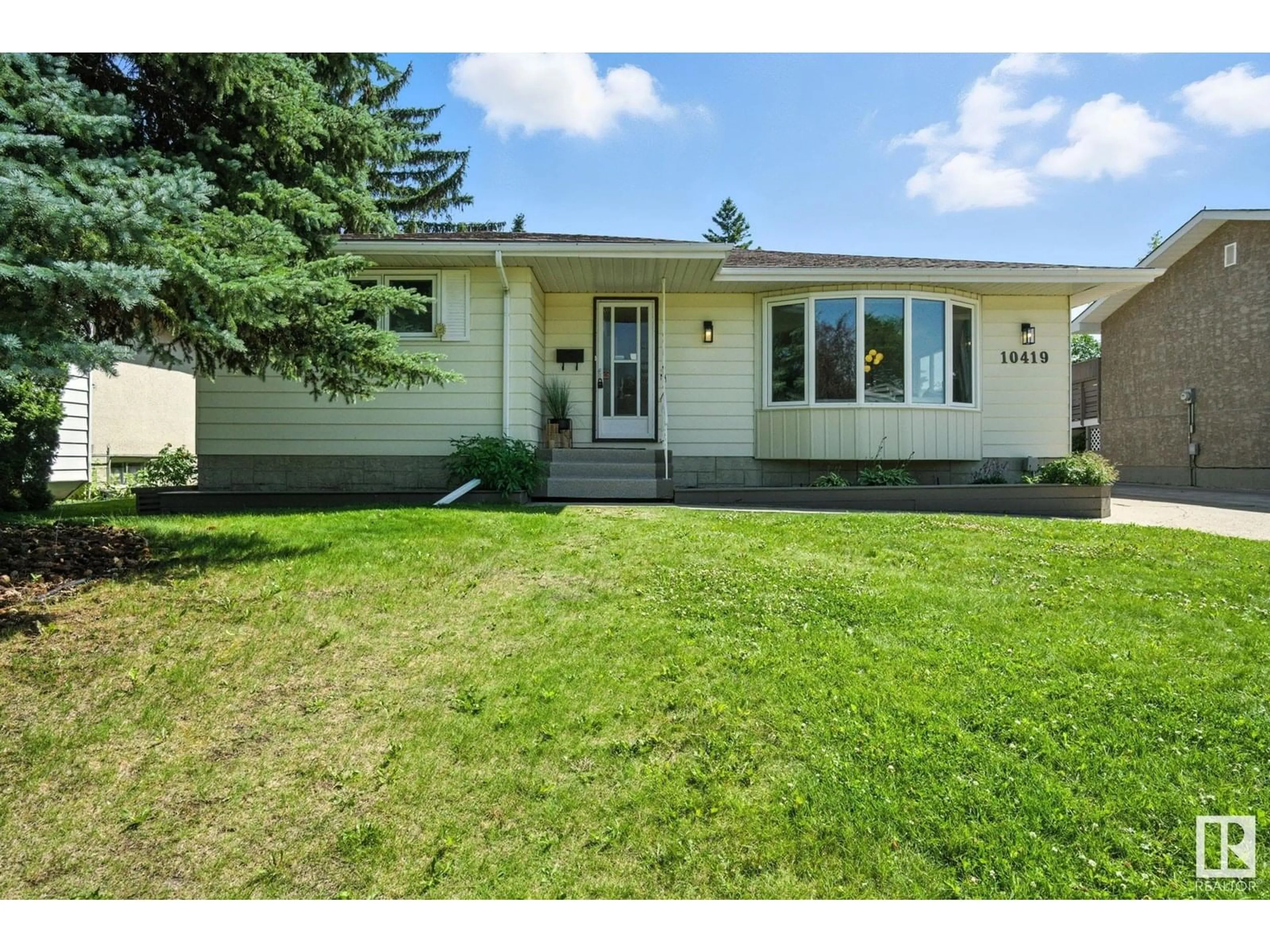 Home with vinyl exterior material, street for 10419 36A AV, Edmonton Alberta T6J2H7
