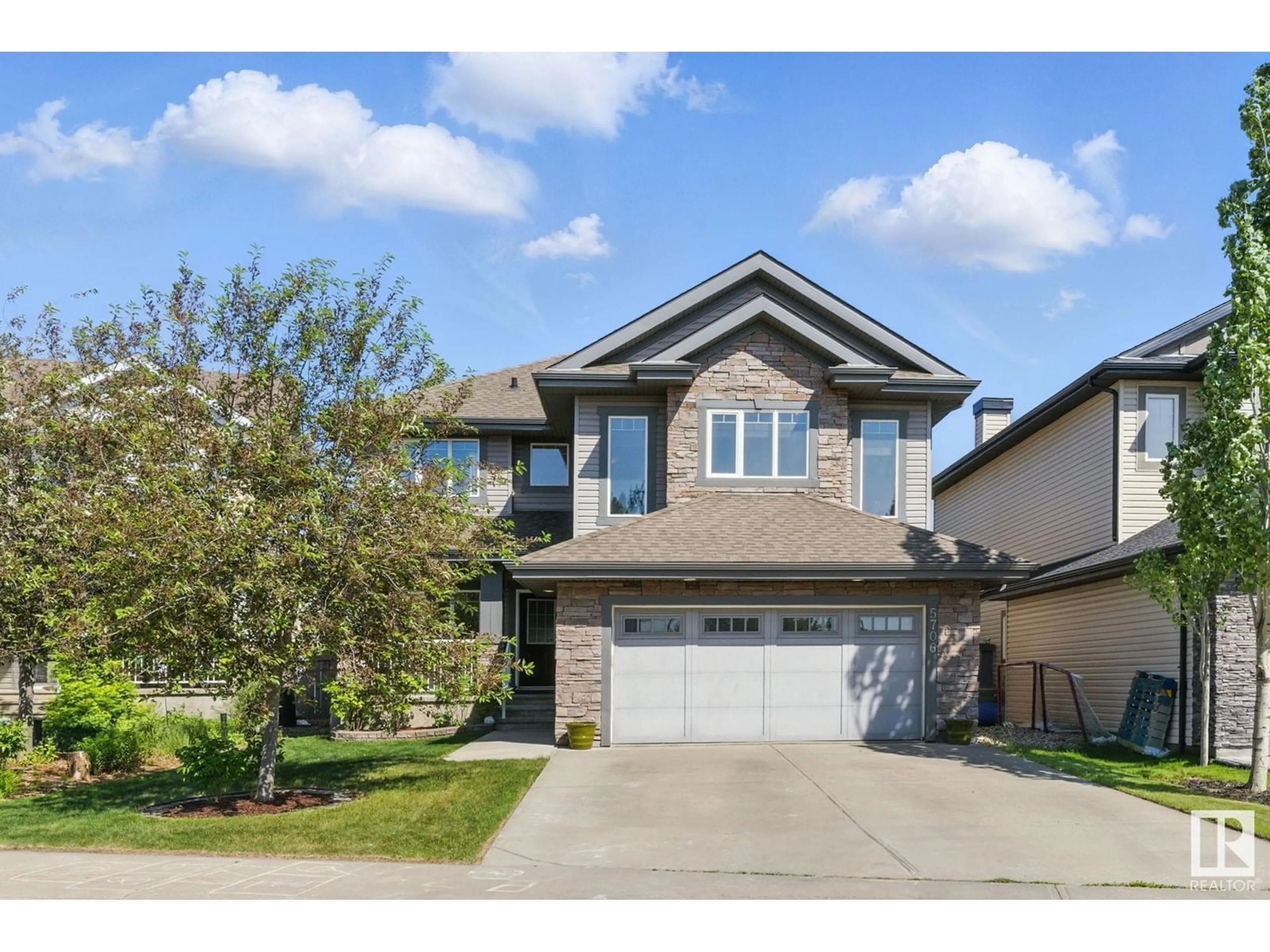 Home with vinyl exterior material, street for 5706 MCLUHAN BAY, Edmonton Alberta T6R0P8