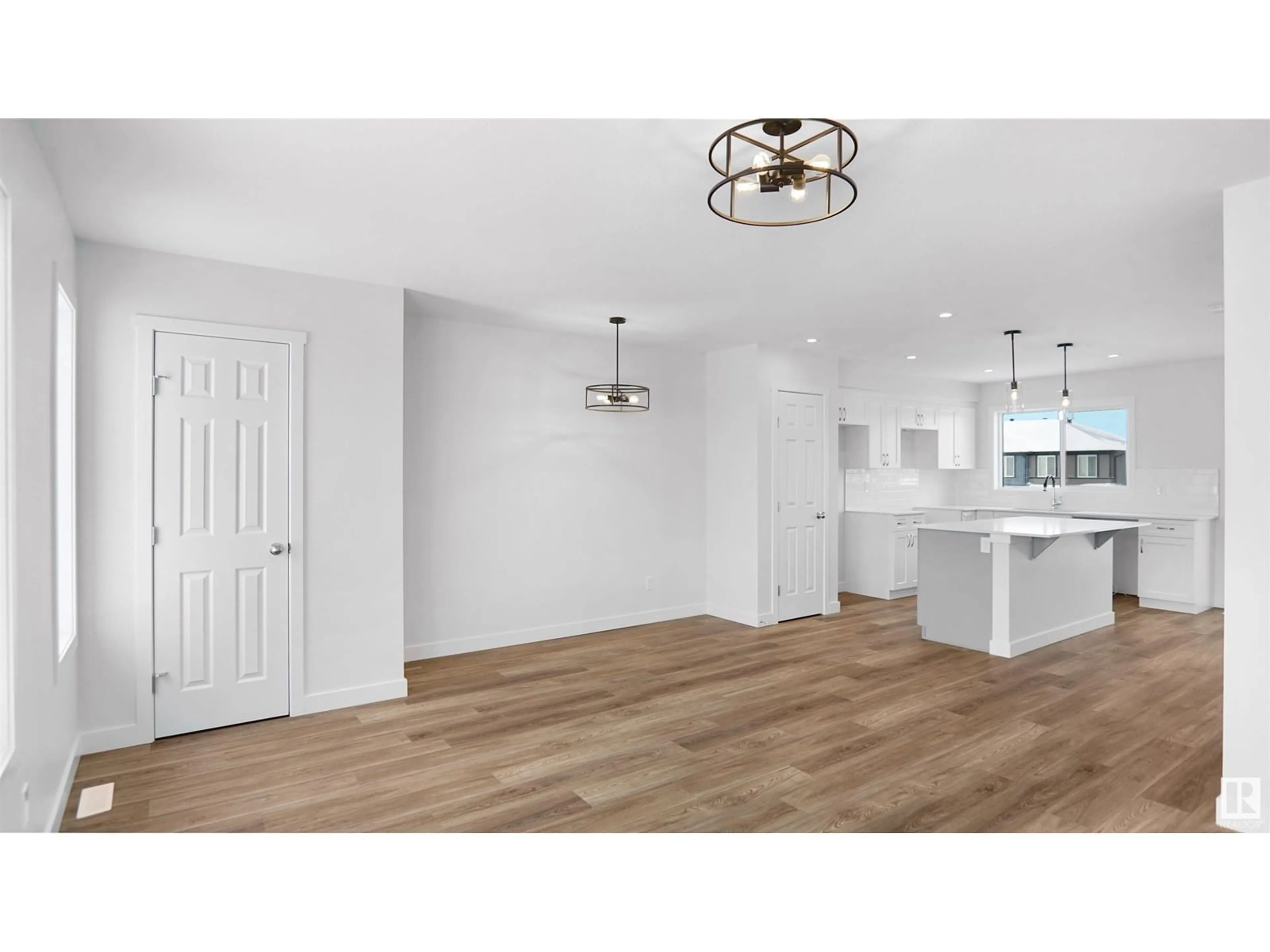 Open concept kitchen, wood/laminate floor for 94 EILLIOT WD, Fort Saskatchewan Alberta T8L1R8
