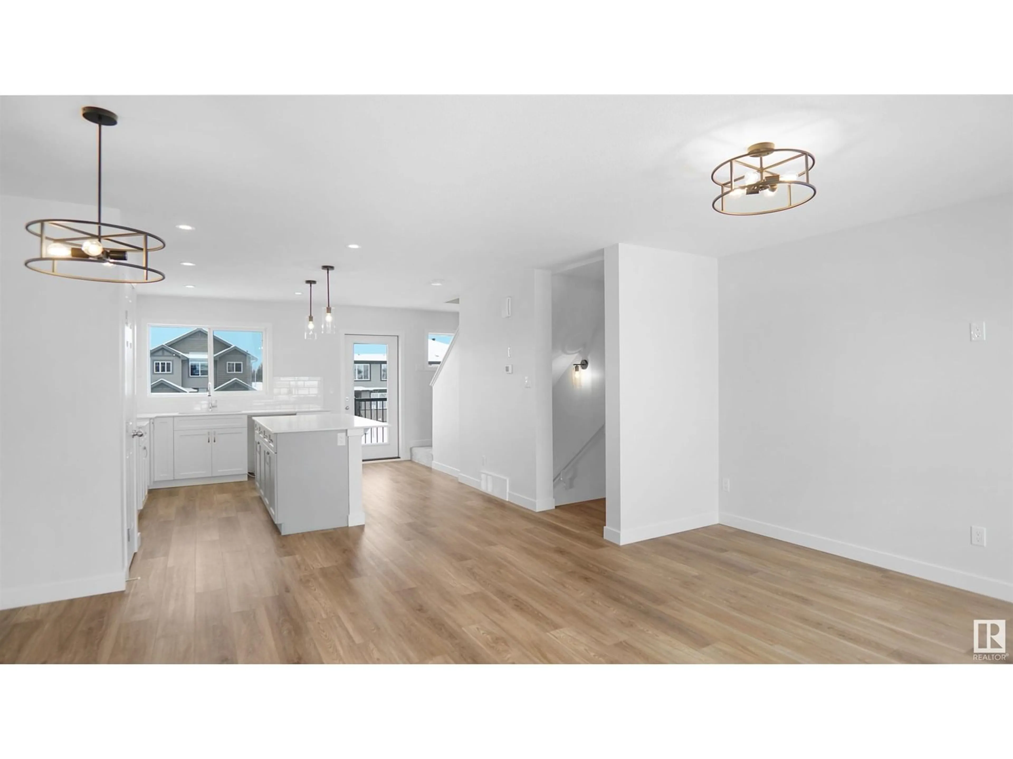 Open concept kitchen, wood/laminate floor for 94 EILLIOT WD, Fort Saskatchewan Alberta T8L1R8
