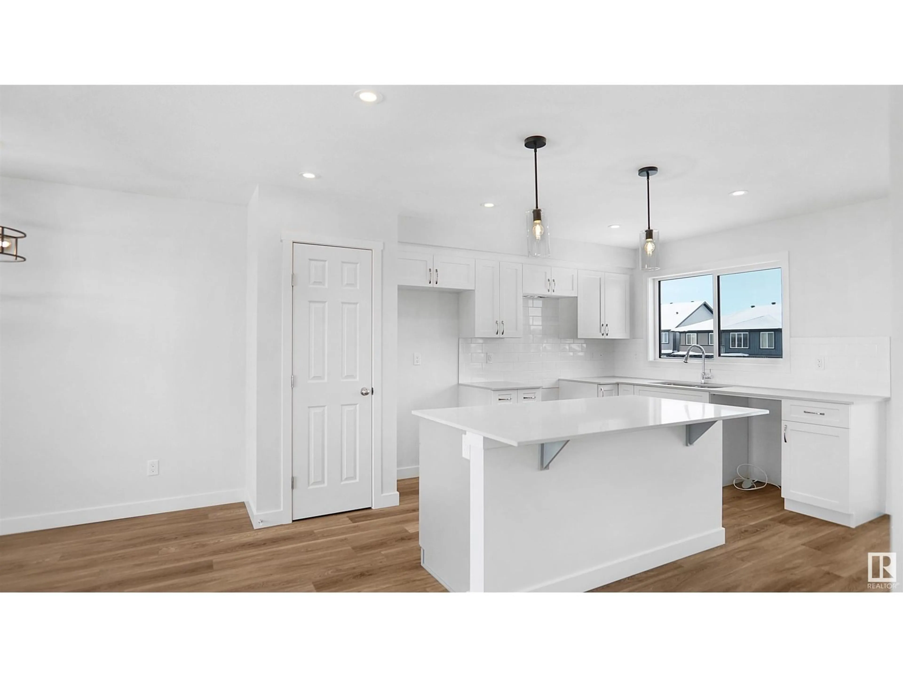 Open concept kitchen, wood/laminate floor for 94 EILLIOT WD, Fort Saskatchewan Alberta T8L1R8