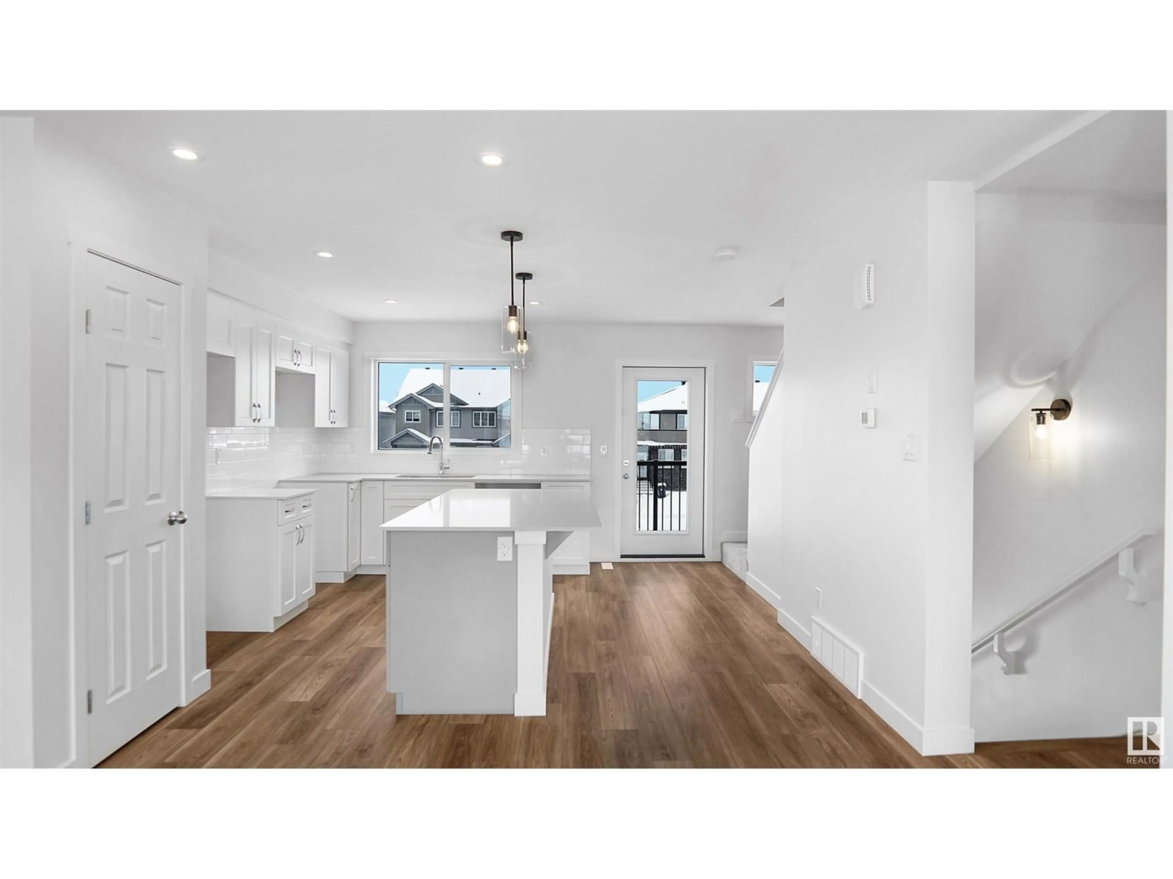 Open concept kitchen, wood/laminate floor for 94 EILLIOT WD, Fort Saskatchewan Alberta T8L1R8
