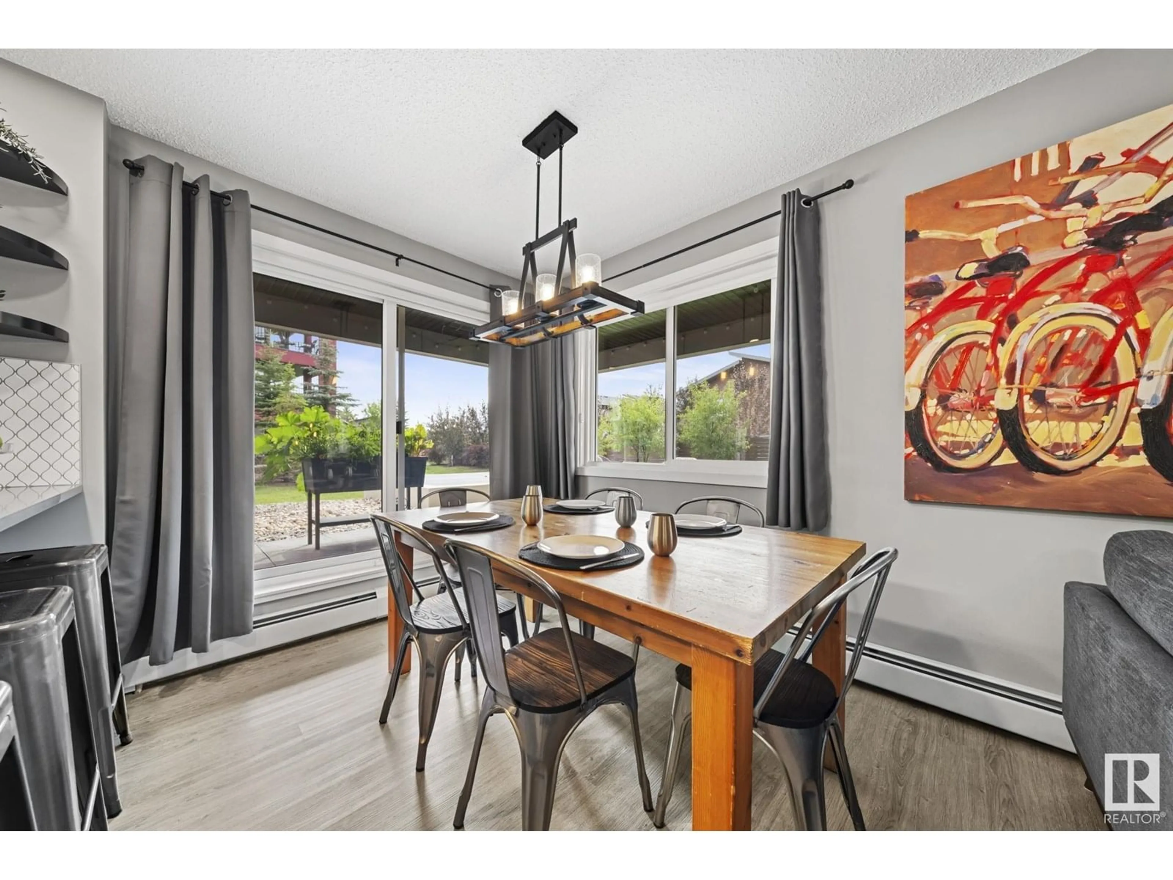 Dining room, wood/laminate floor for #102 - 394 WINDERMERE RD, Edmonton Alberta T6W0R1