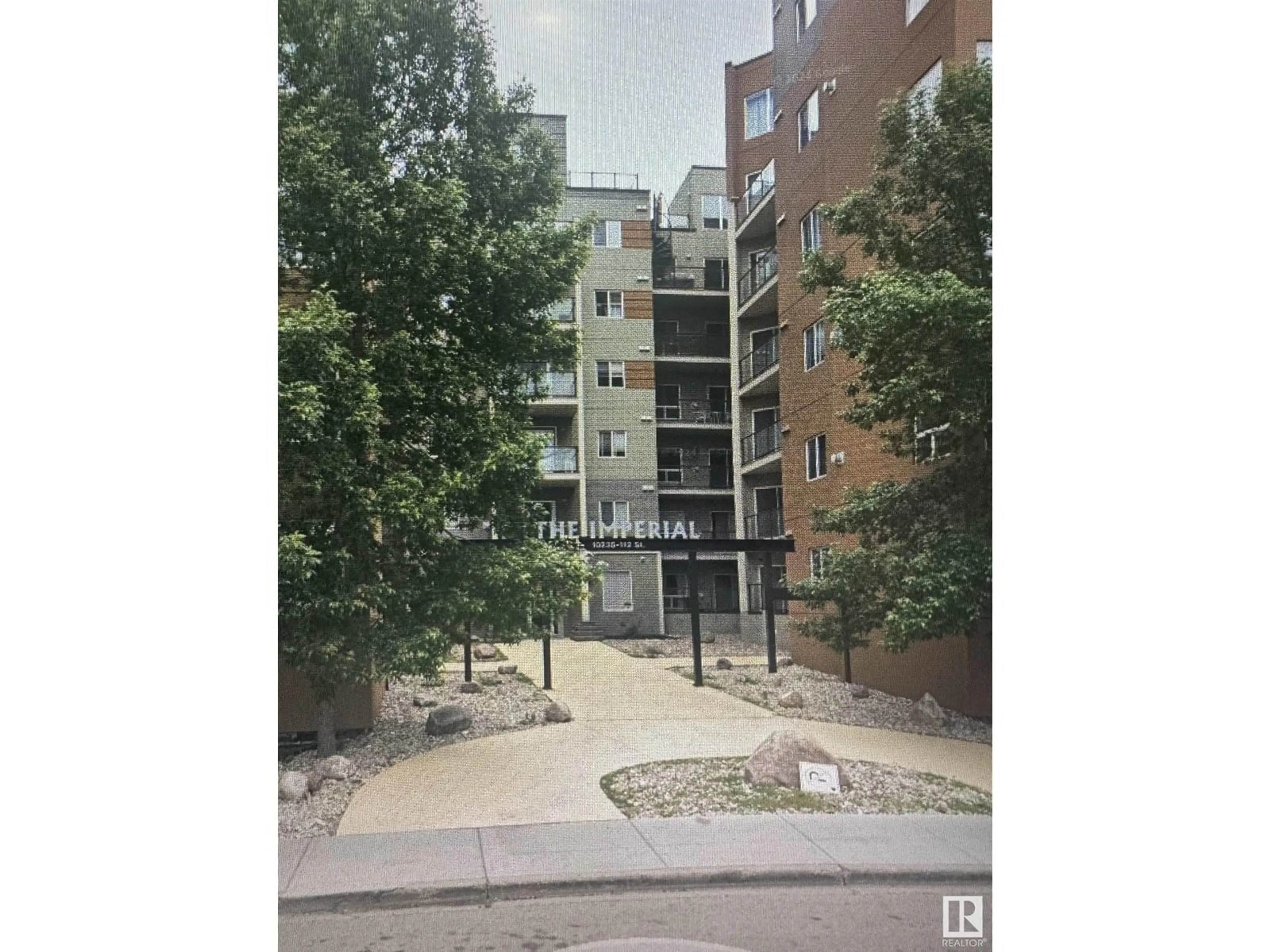 A pic from outside/outdoor area/front of a property/back of a property/a pic from drone, street for #212 - 10235 112 ST NW, Edmonton Alberta T5K1M7