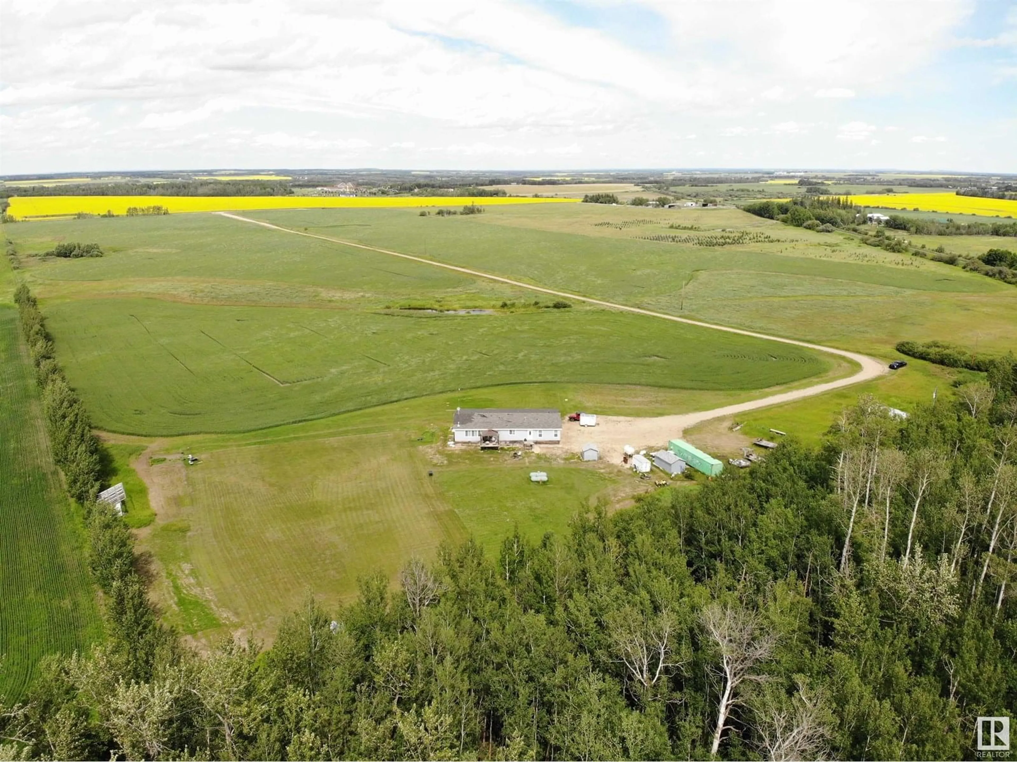 A pic from outside/outdoor area/front of a property/back of a property/a pic from drone, water/lake/river/ocean view for 27011 TWP RD 580, Rural Westlock County Alberta T0G0A6