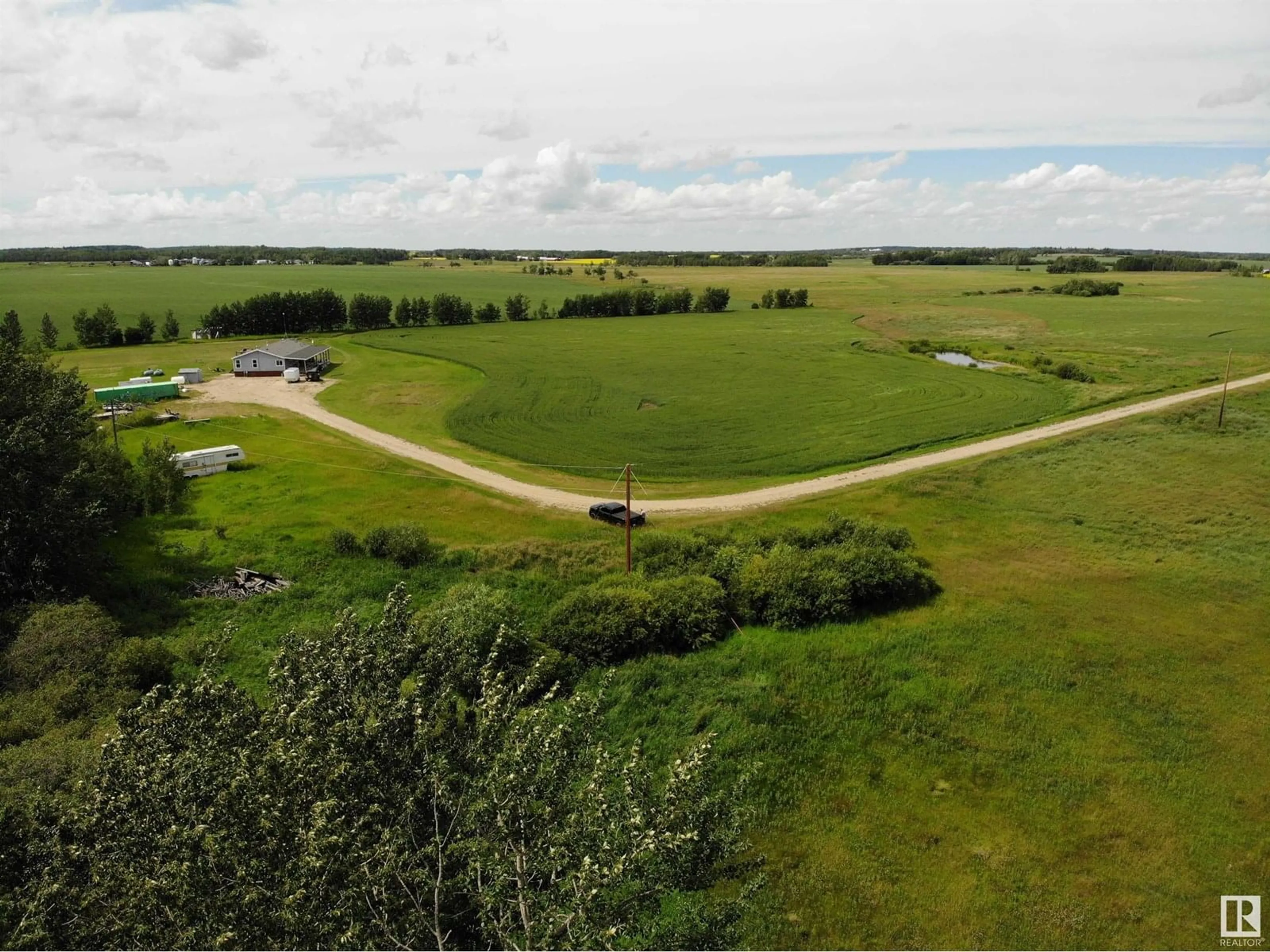 A pic from outside/outdoor area/front of a property/back of a property/a pic from drone, unknown for 27011 TWP RD 580, Rural Westlock County Alberta T0G0A6