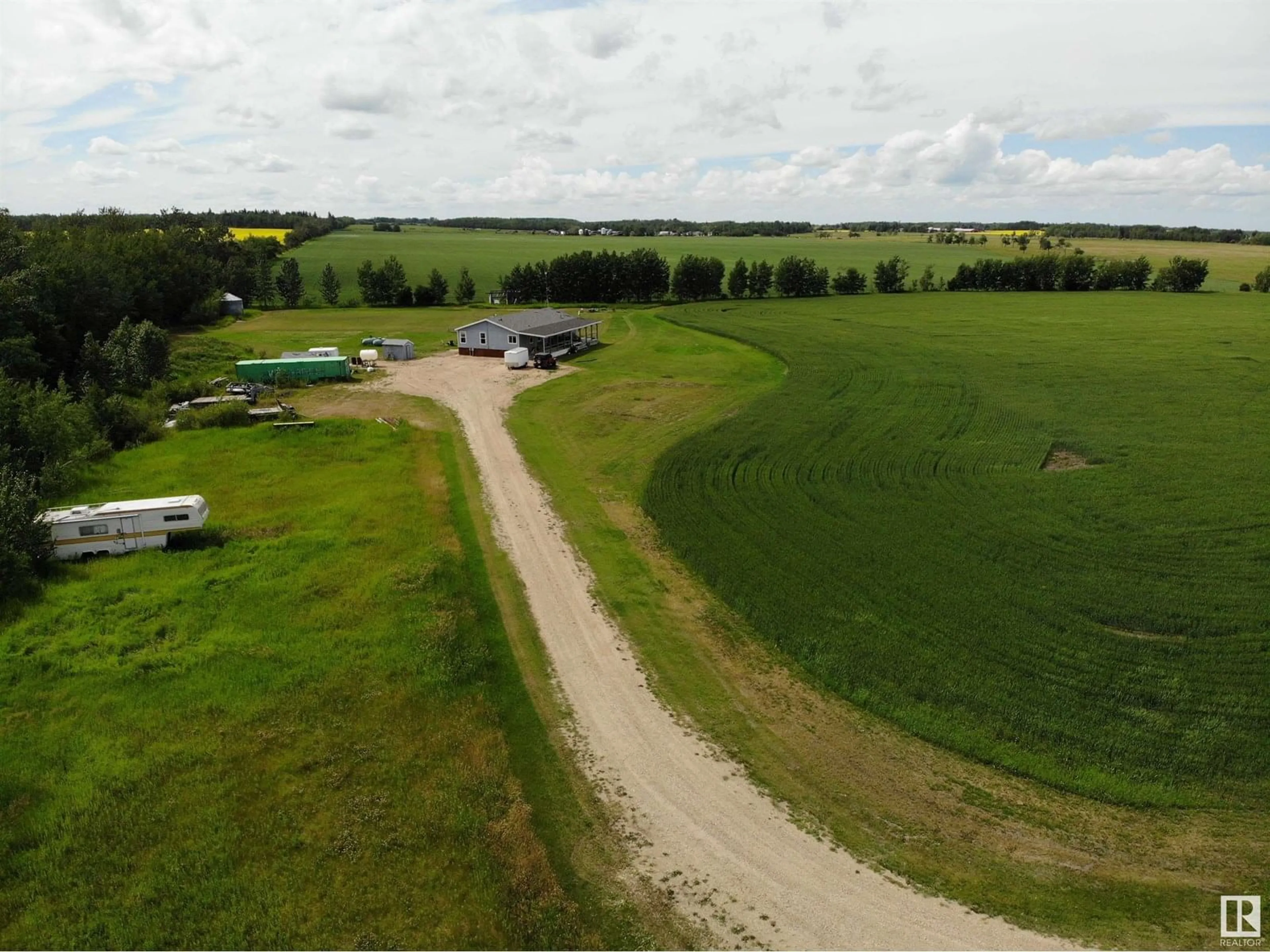 A pic from outside/outdoor area/front of a property/back of a property/a pic from drone, unknown for 27011 TWP RD 580, Rural Westlock County Alberta T0G0A6