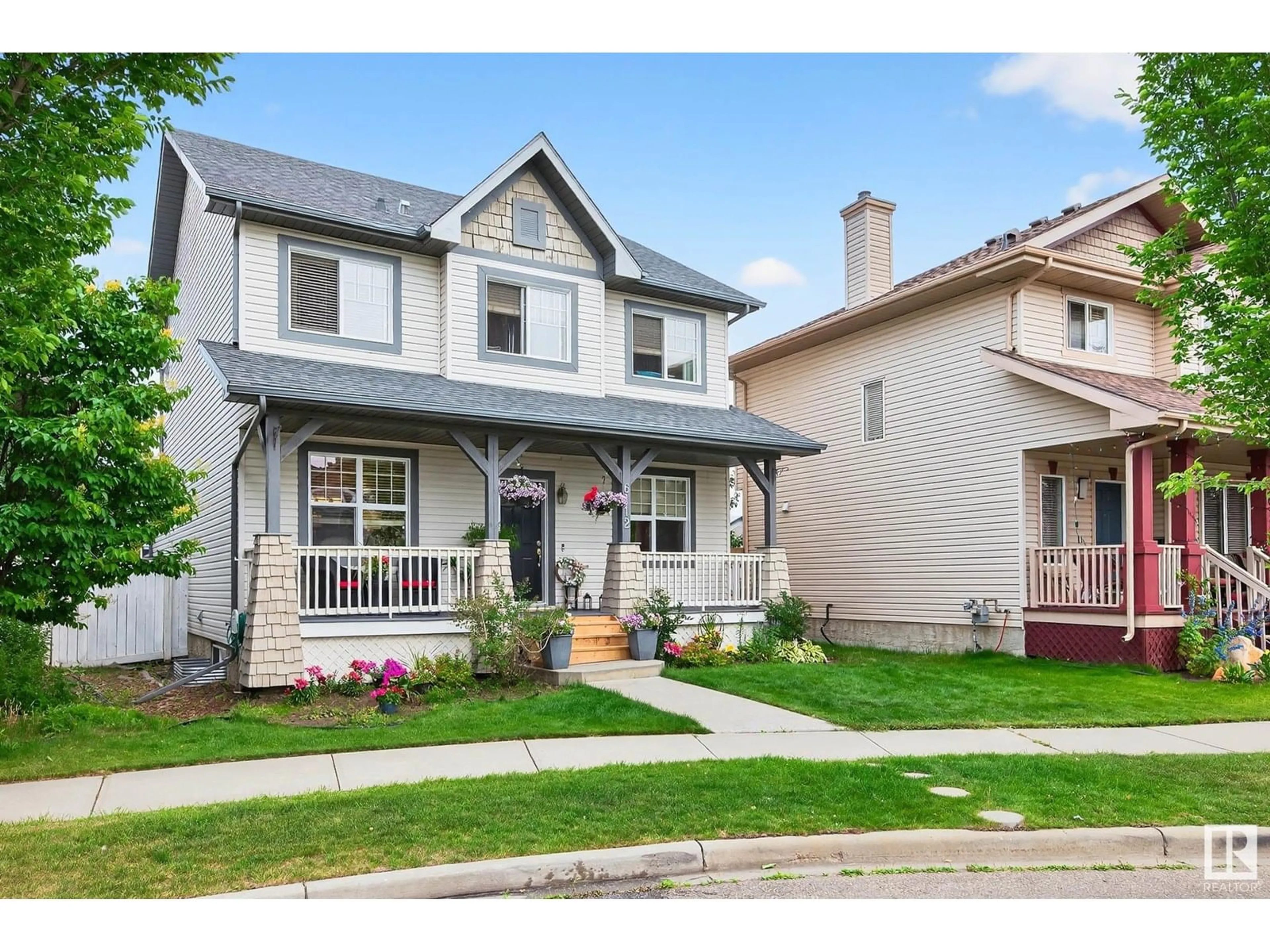 Home with vinyl exterior material, street for 6112 STINSON WY, Edmonton Alberta T6K0K2