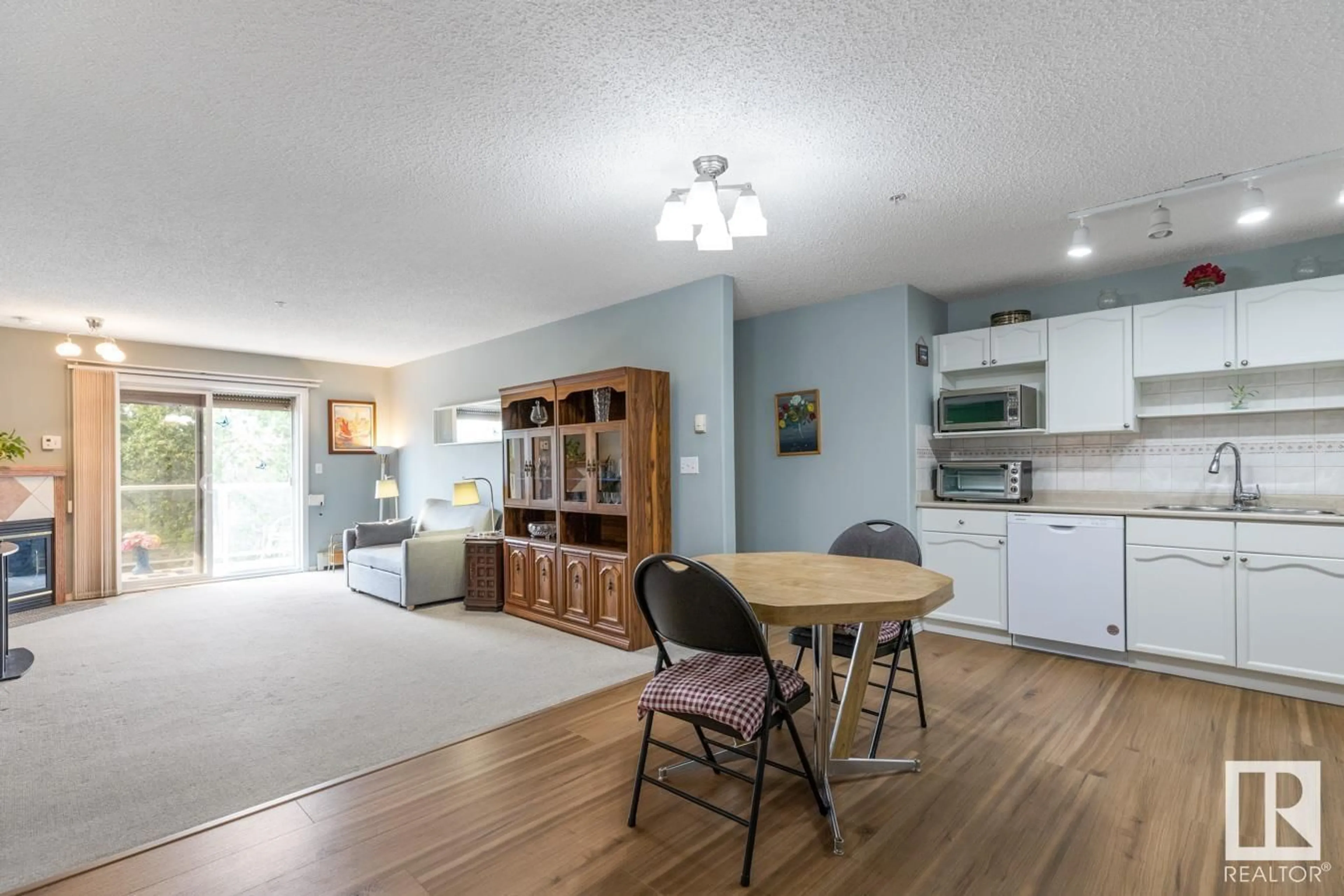 Open concept kitchen, wood/laminate floor for 301 - 5116 49 AV, Leduc Alberta T9E8K1