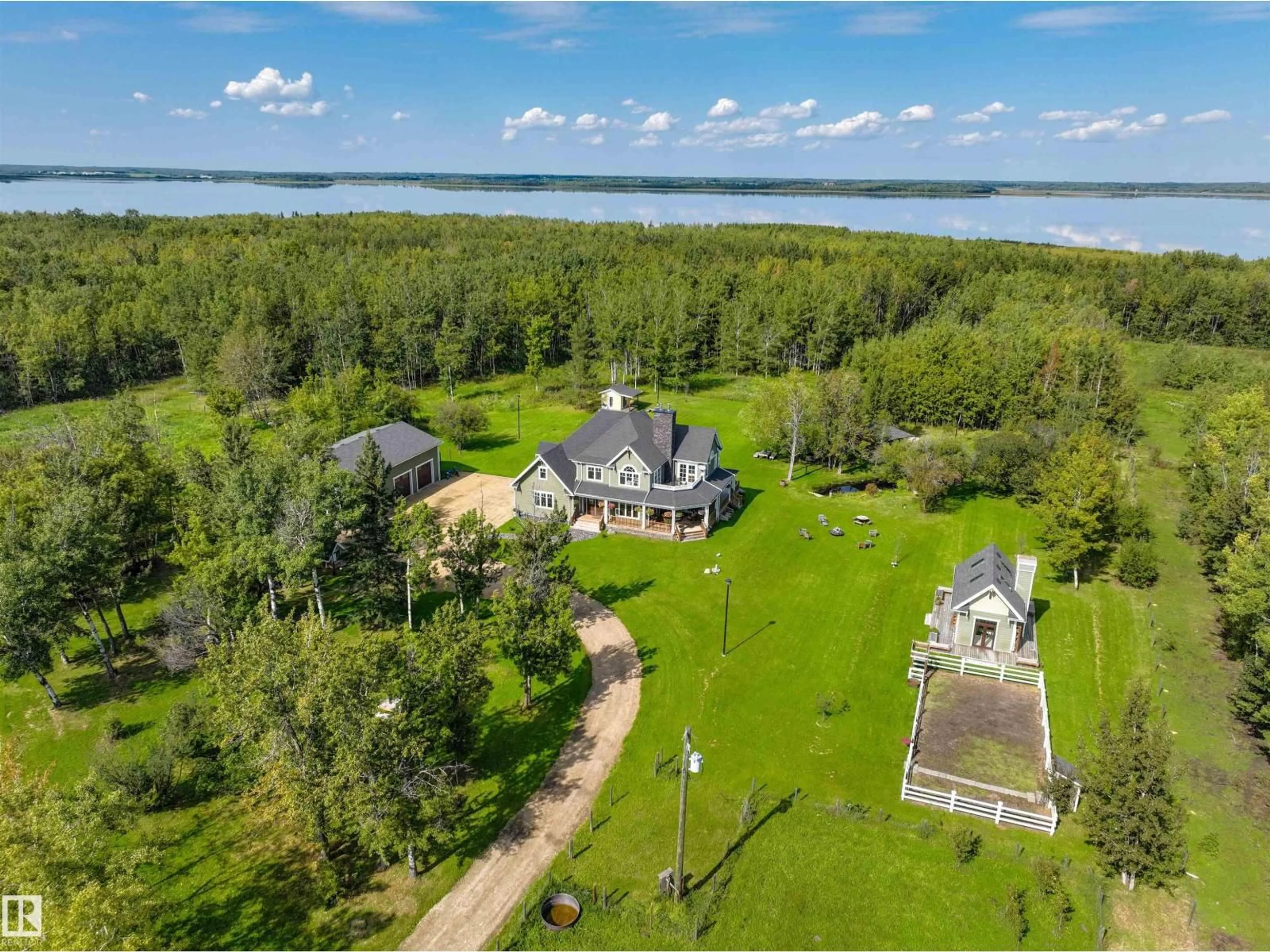 A pic from outside/outdoor area/front of a property/back of a property/a pic from drone, water/lake/river/ocean view for 51218 - 37 RGE ROAD 214 RGE, Rural Strathcona County Alberta T8E1G9