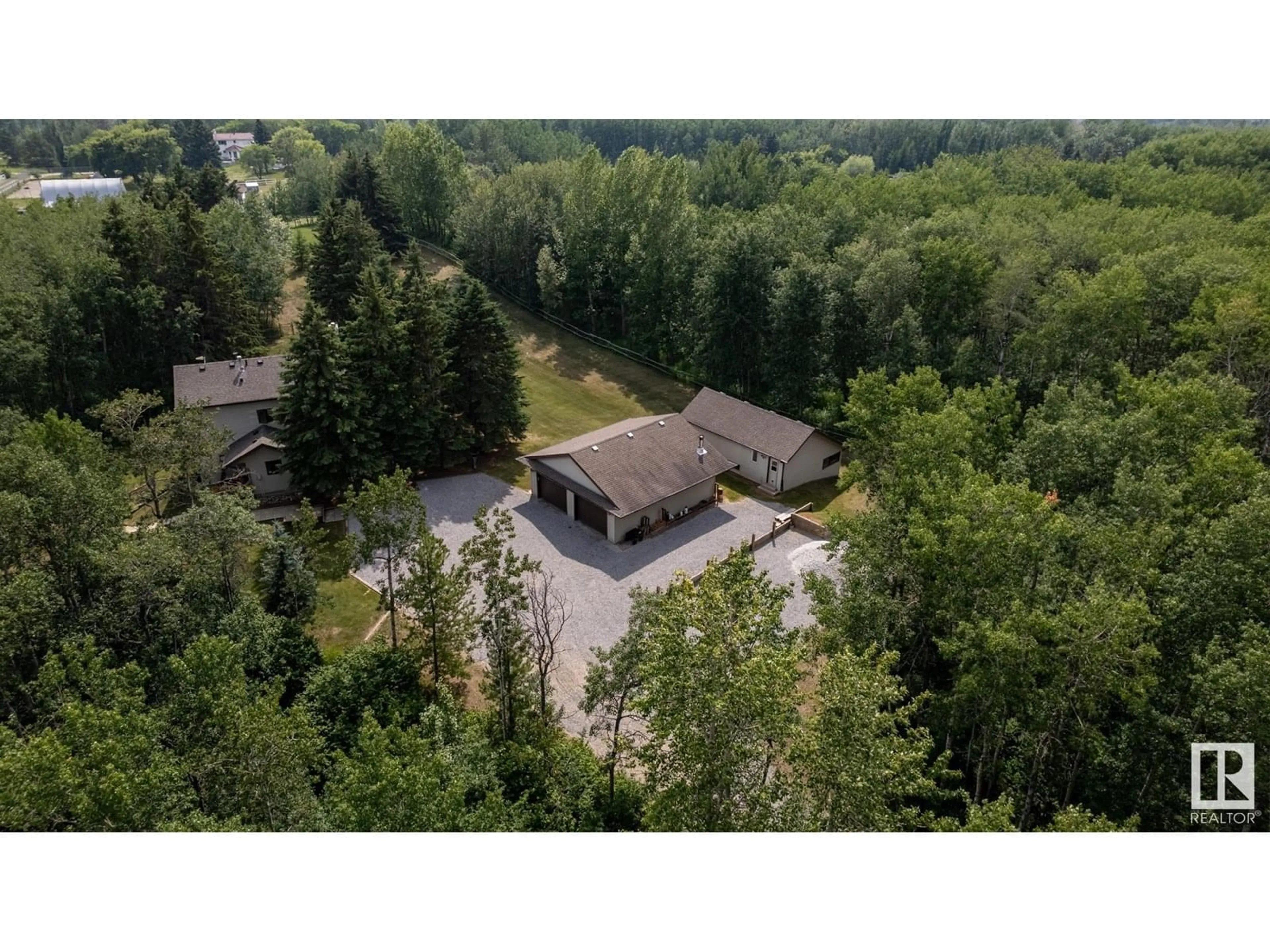 A pic from outside/outdoor area/front of a property/back of a property/a pic from drone, forest/trees view for 52437 - 23 RANGE ROAD 21, Rural Parkland County Alberta T7Y2H1