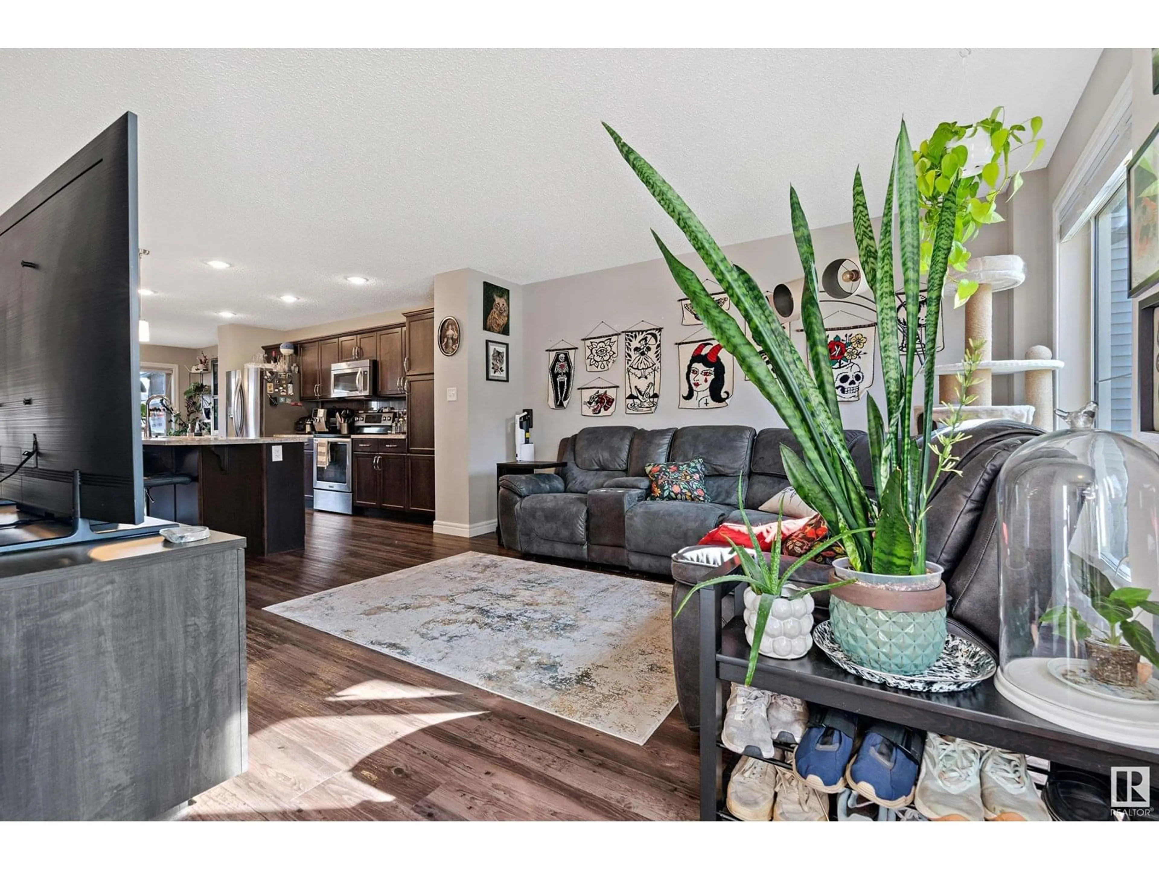 Living room with furniture, wood/laminate floor for SW - 3066 KESWICK WY, Edmonton Alberta T6W2R2
