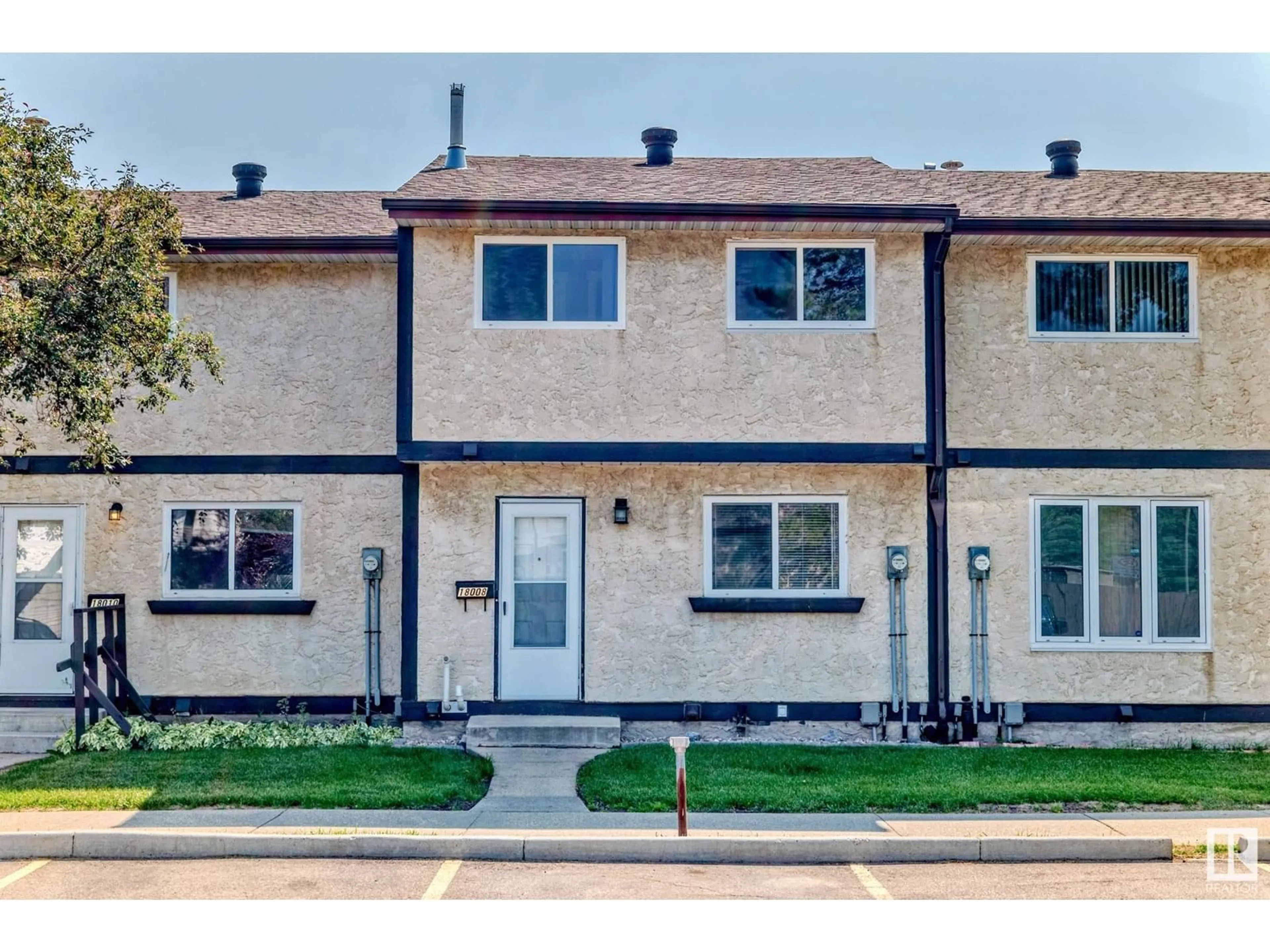 Home with vinyl exterior material, street for 18008 93 AV, Edmonton Alberta T5T1Y1
